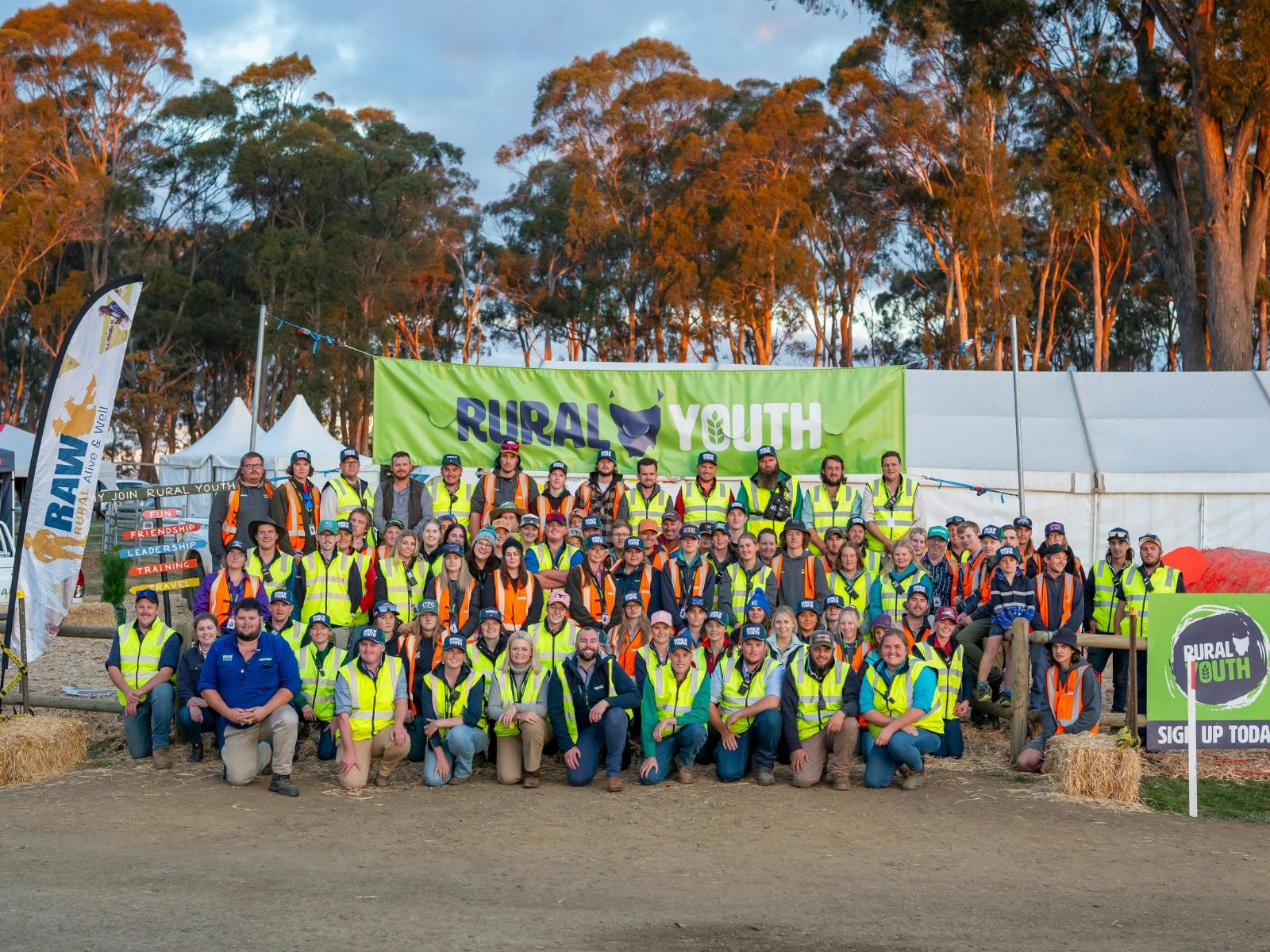 A group of Rural Youth members pose together, wearing matching shirts at Agfest.