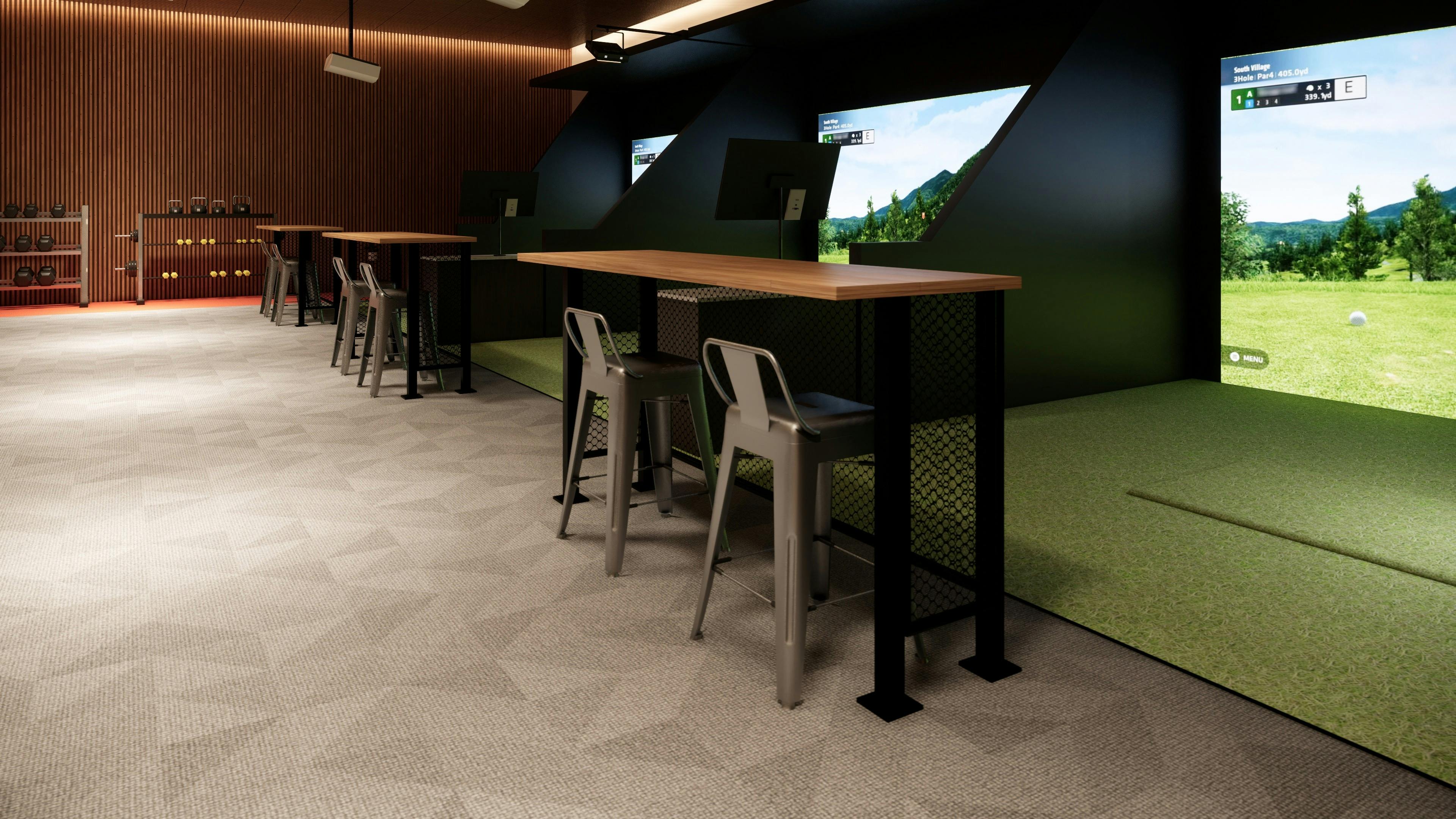 Modern indoor golf venue with multiple simulator bays and seating area.