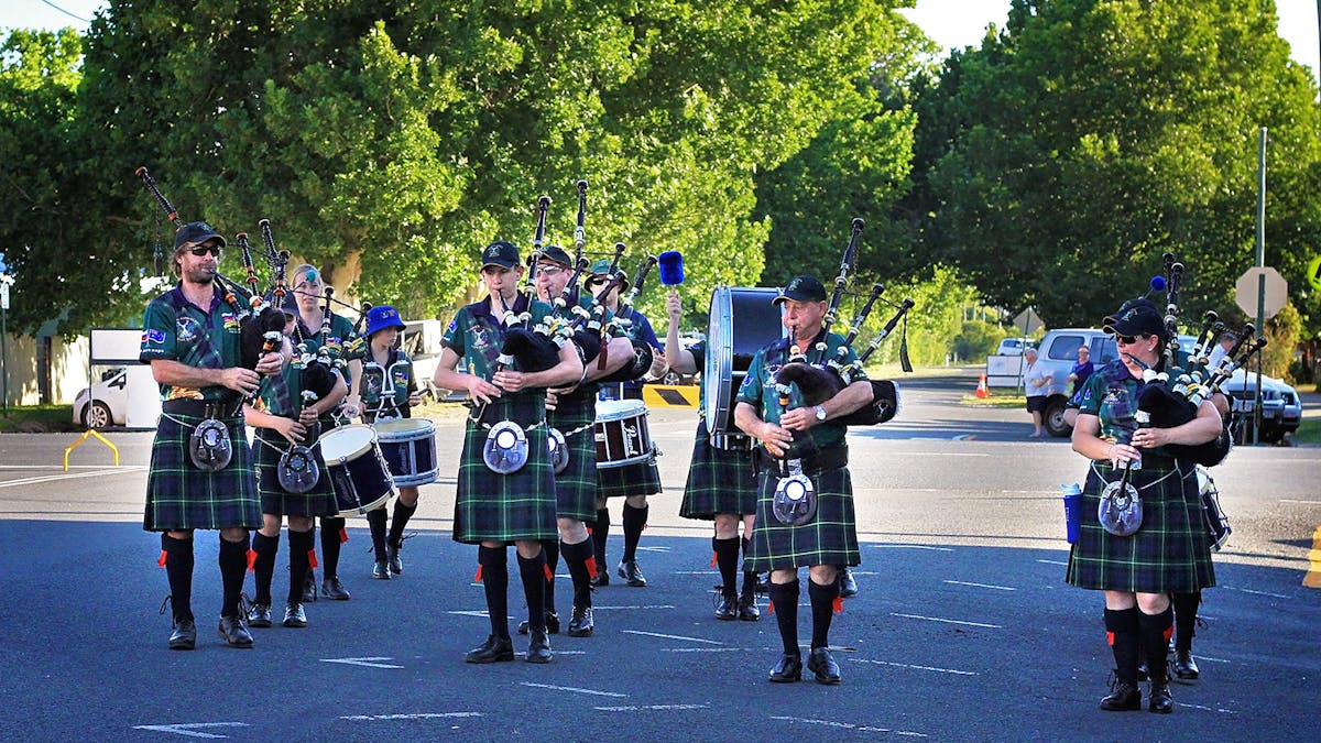 Warwick Thistle Pipe Band plays bagpipes for guests. Traditional and Christmas Music. Street Parade.