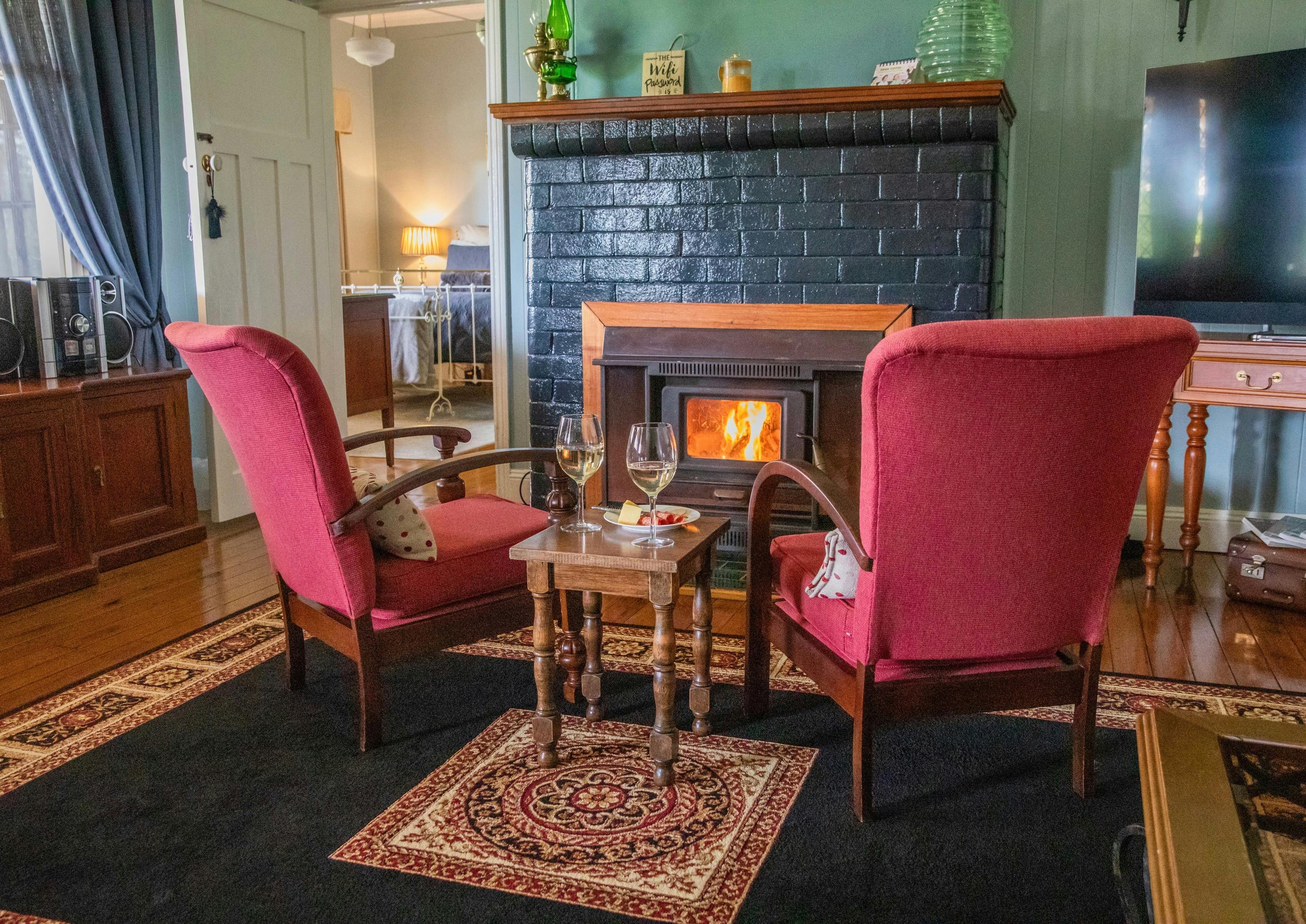 Relax in front of the fireplace and enjoy your favourite beverage.