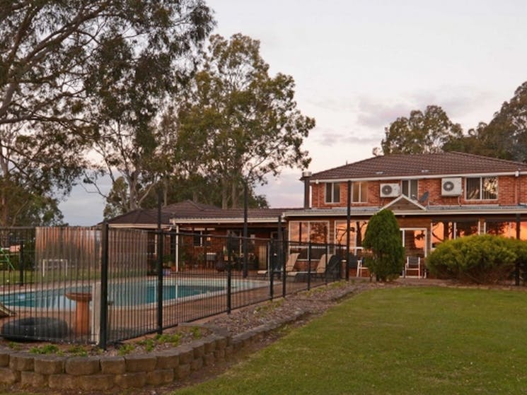 Photo of backyard and swimming pool at Bella Wind Bed and Breakfast