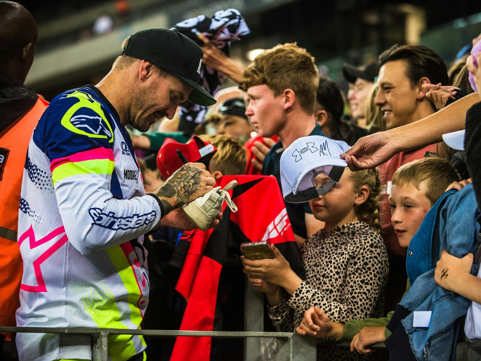 Rider signing autographs.