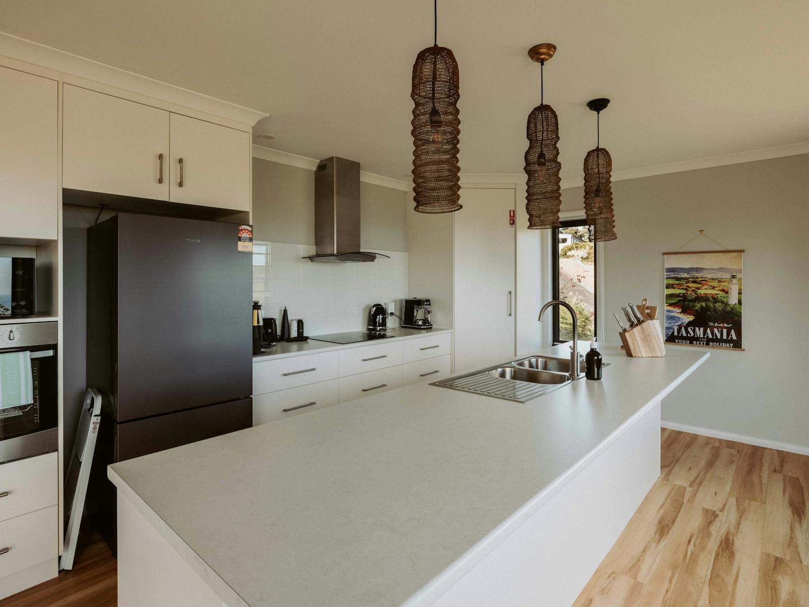 The kitchen features a brand-new oven, fridge, and high-quality appliances.