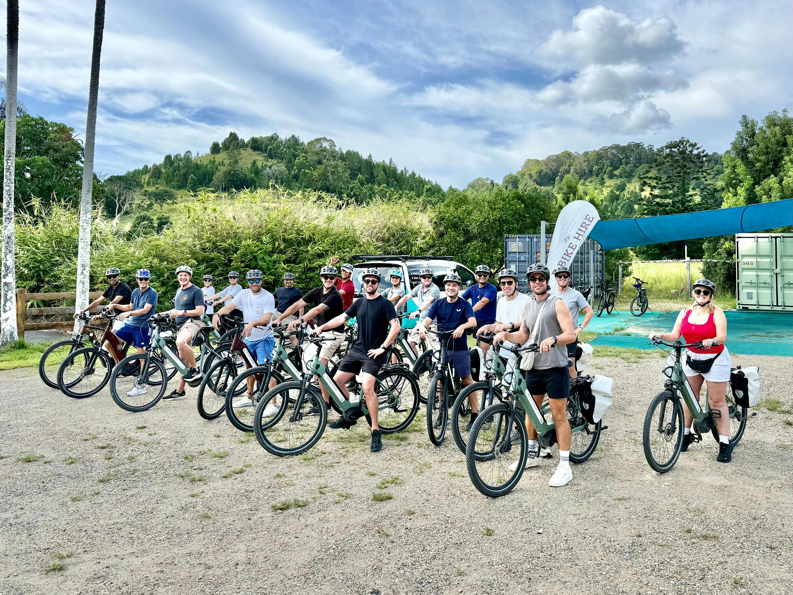Large group of riders on E Bikes at Mooball location opposite the Rail Trail