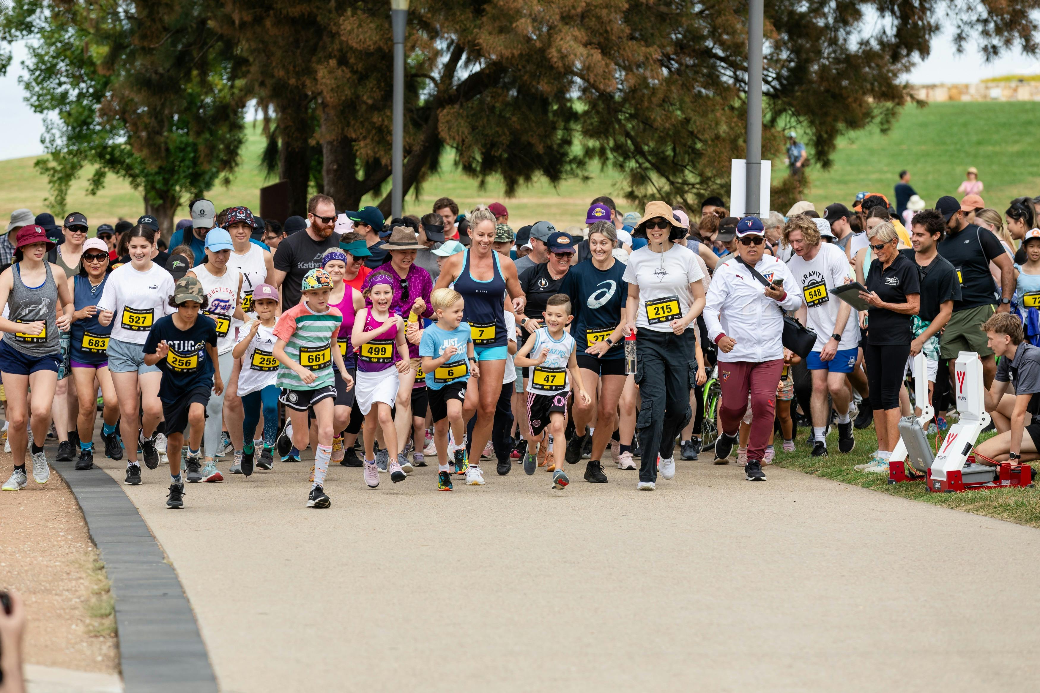 Group of people running and participating in the fun run