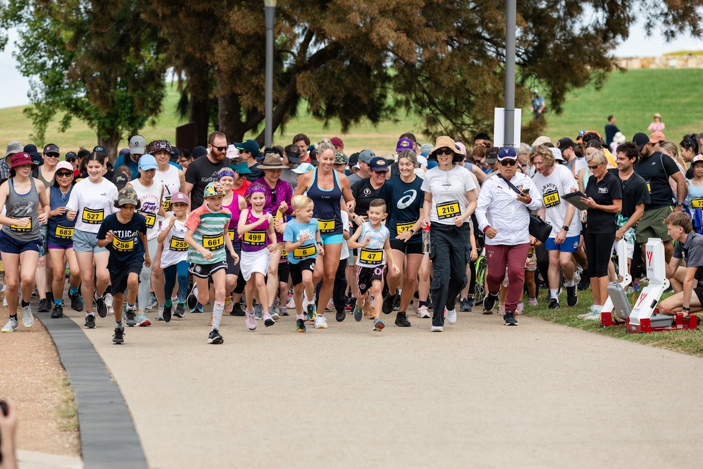 Group of people running and participating in the fun run