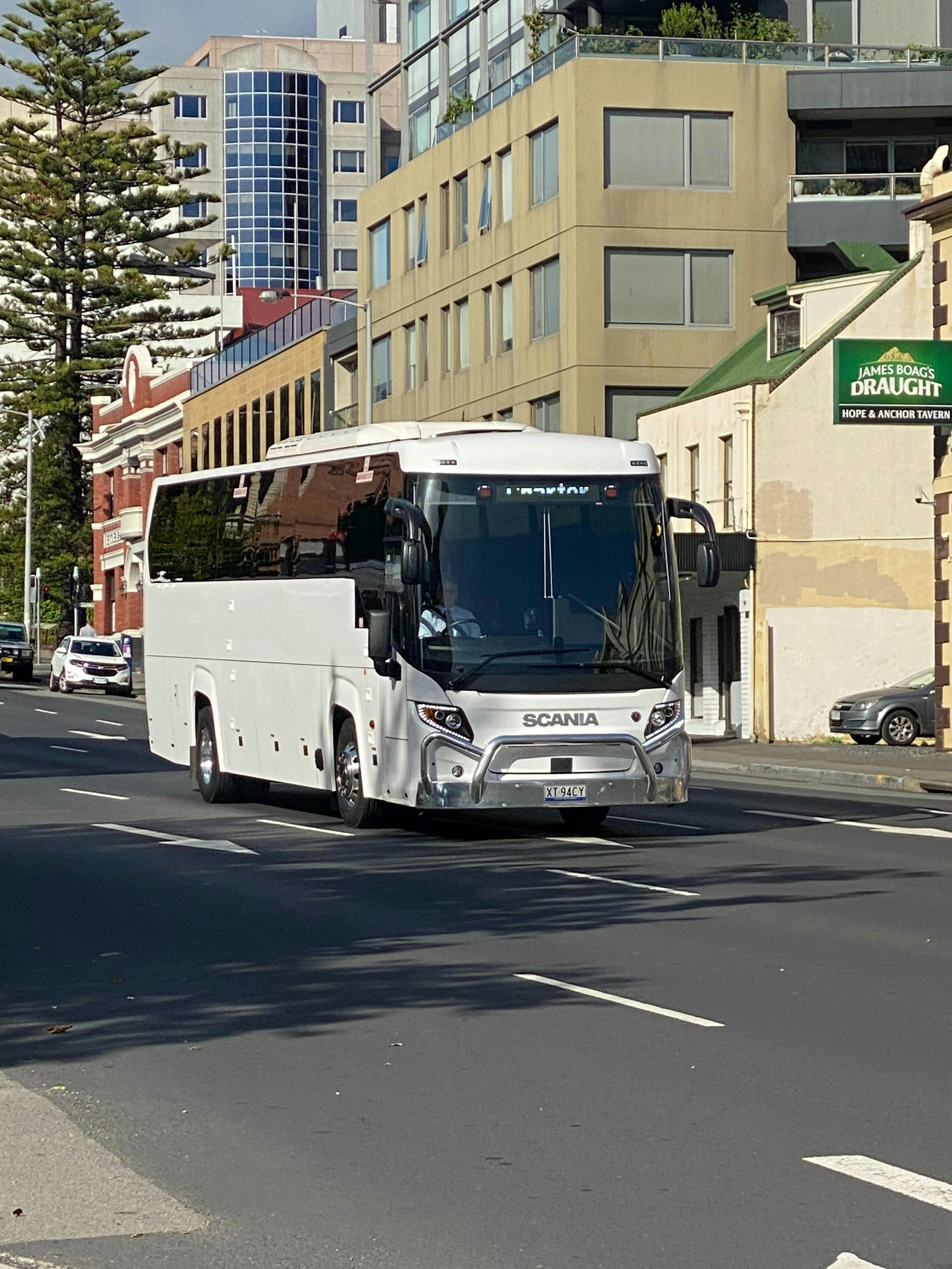 Luxury Coach transporting group through Hobart city