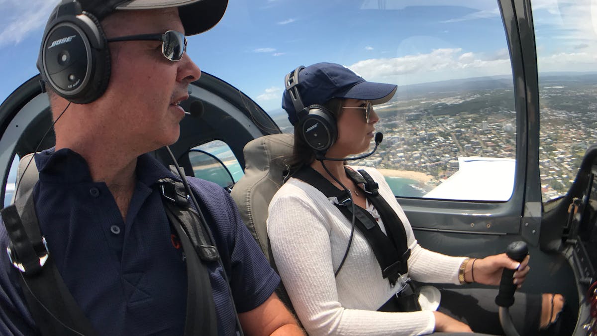 tourist flying Sling plane