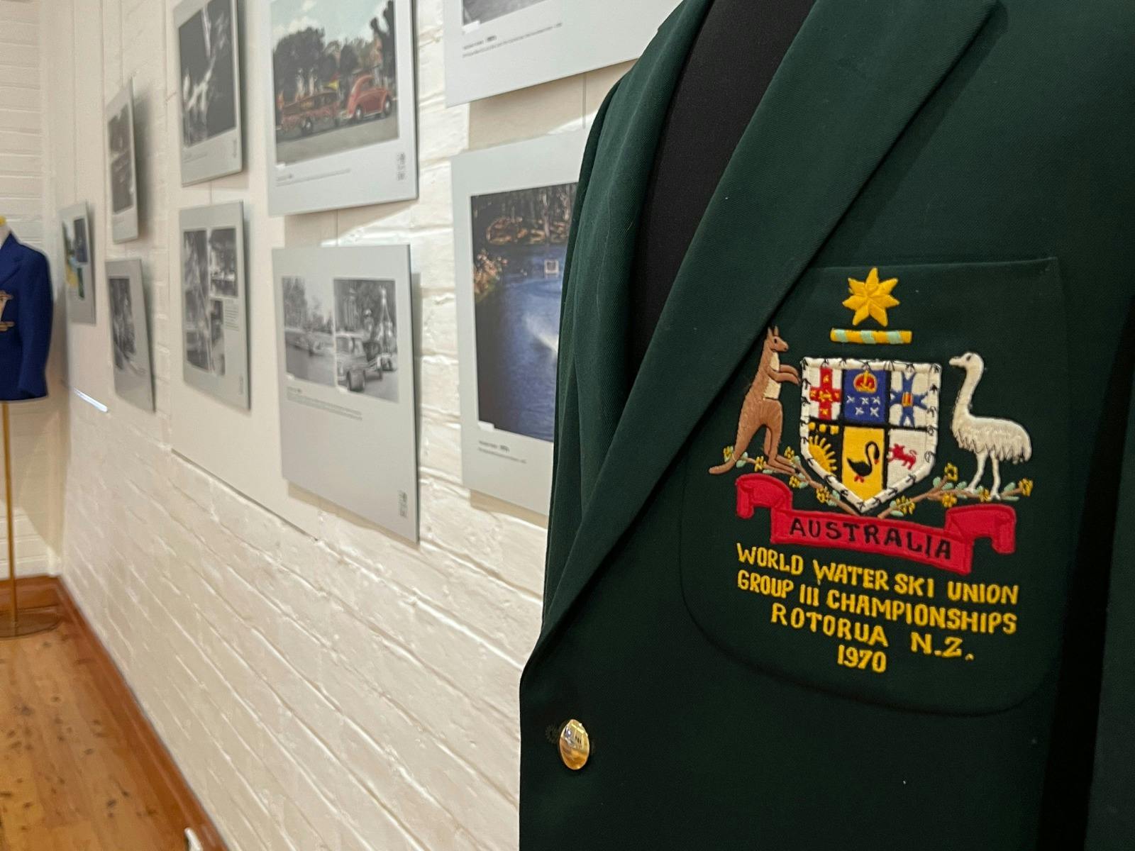 A detail of a green jacket with a crest for the World Water Ski Union