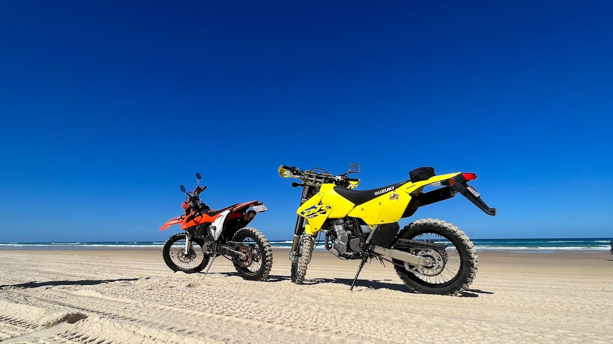 Two dirt bikes on the beach Two dirt bikes on the beach