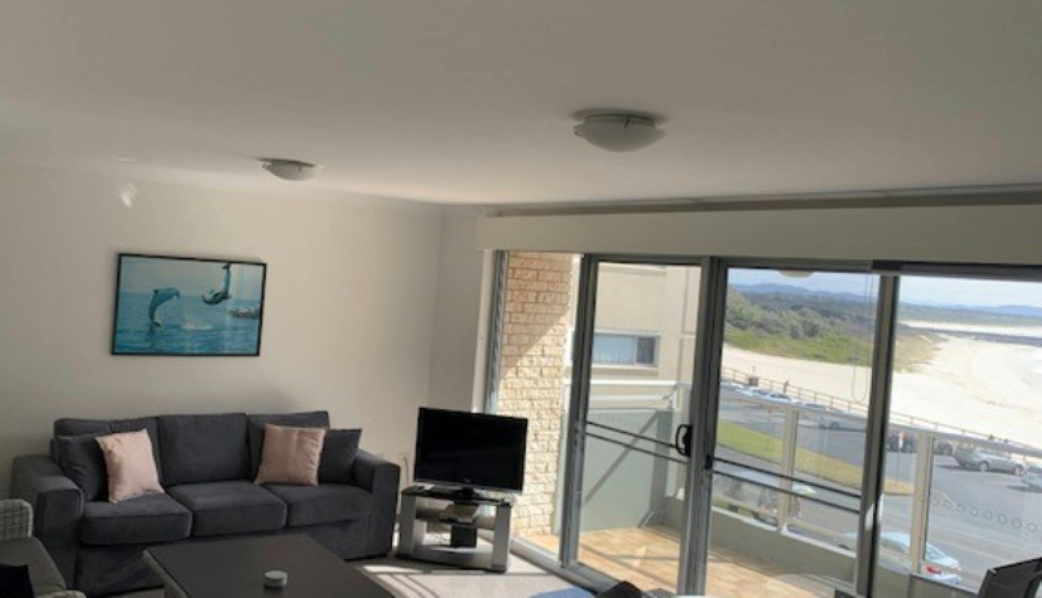 Lounge room looking out to balcony and beach views