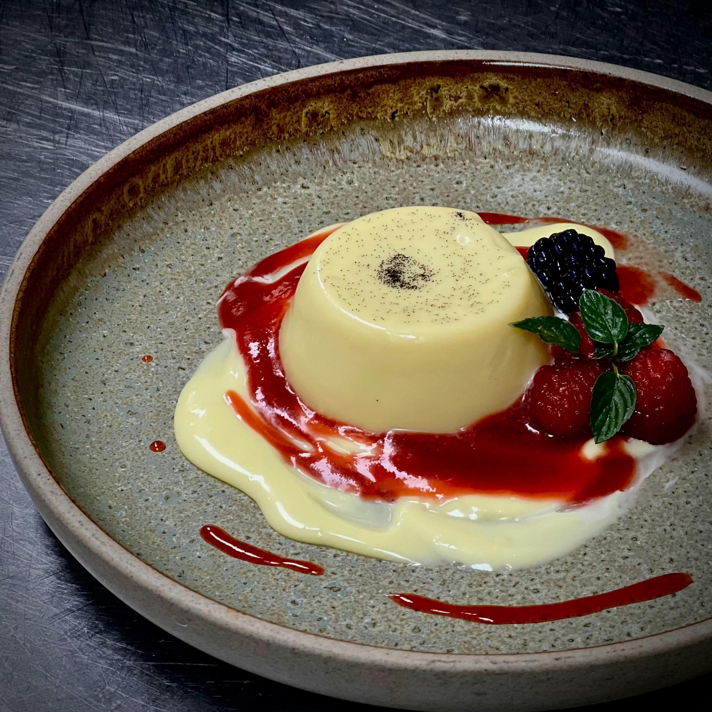 panacotta with strawberry coulis & white chocolate ganache.