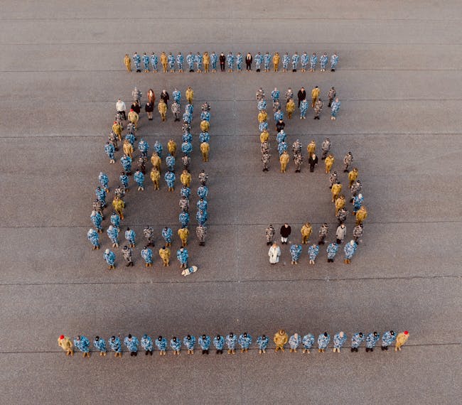 Aerial image of ADF, APS, and contractor personnel at RAAF Base Wagga forming the number 85.