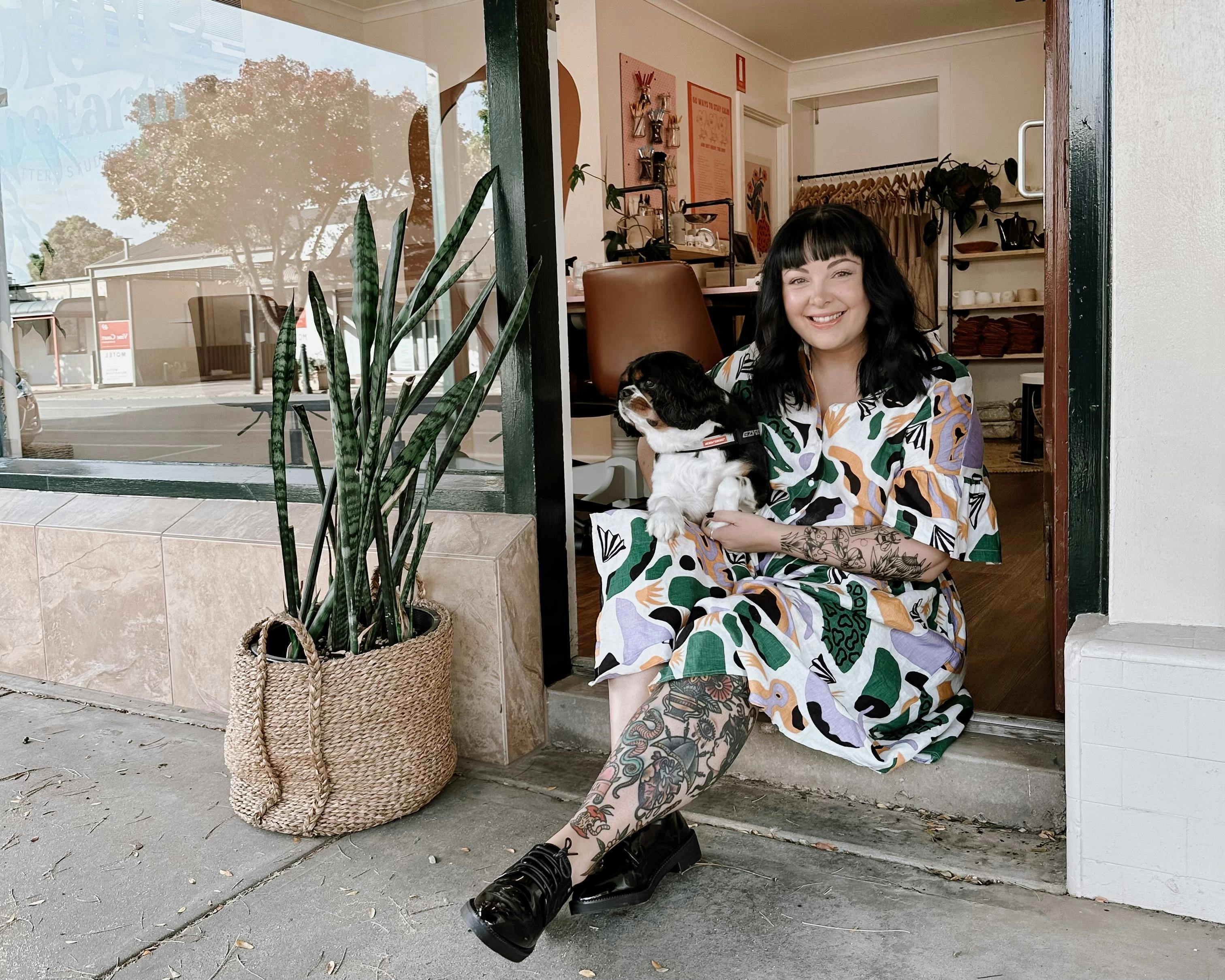 Girl with dog in doorway