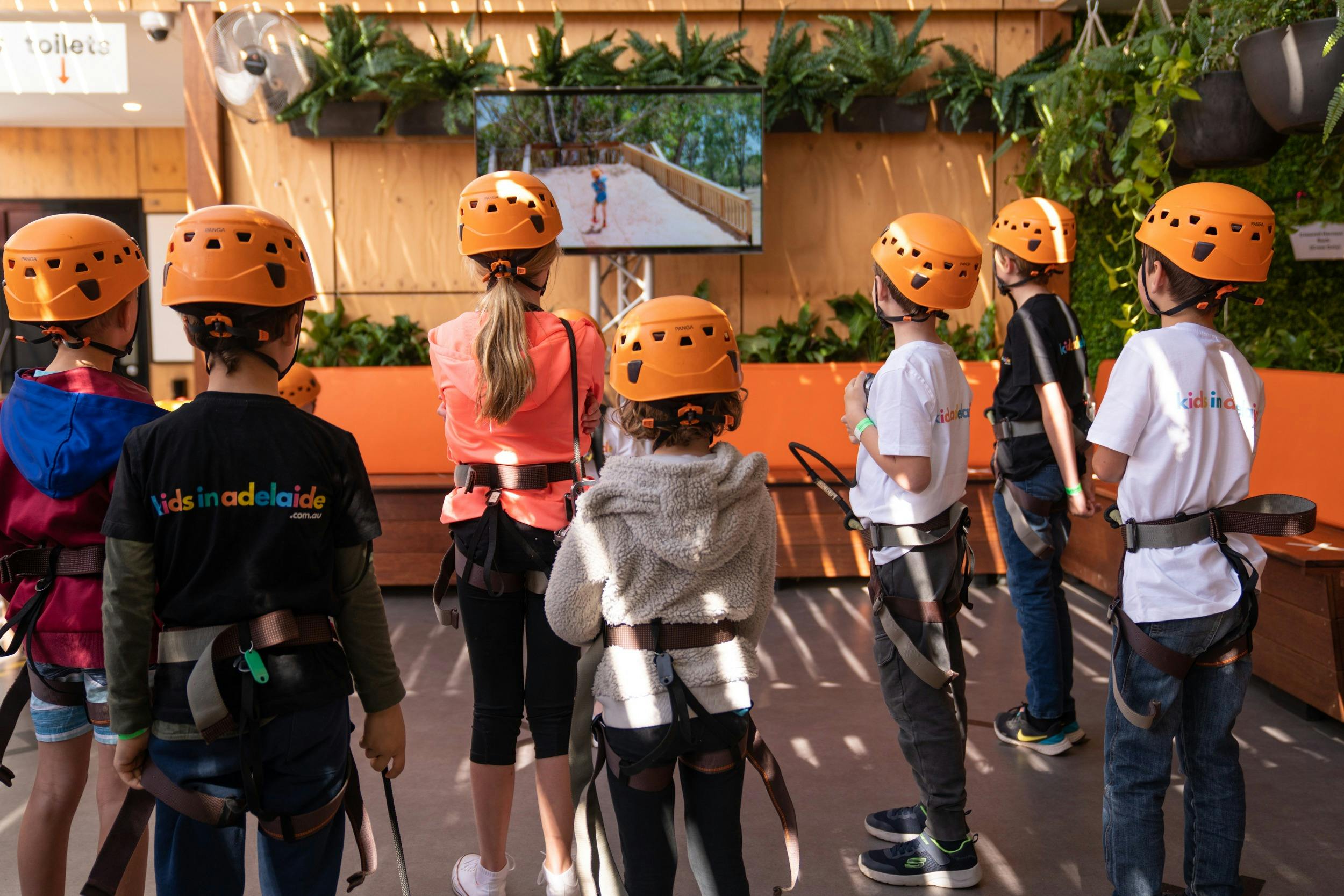 Climbers watch the safety video