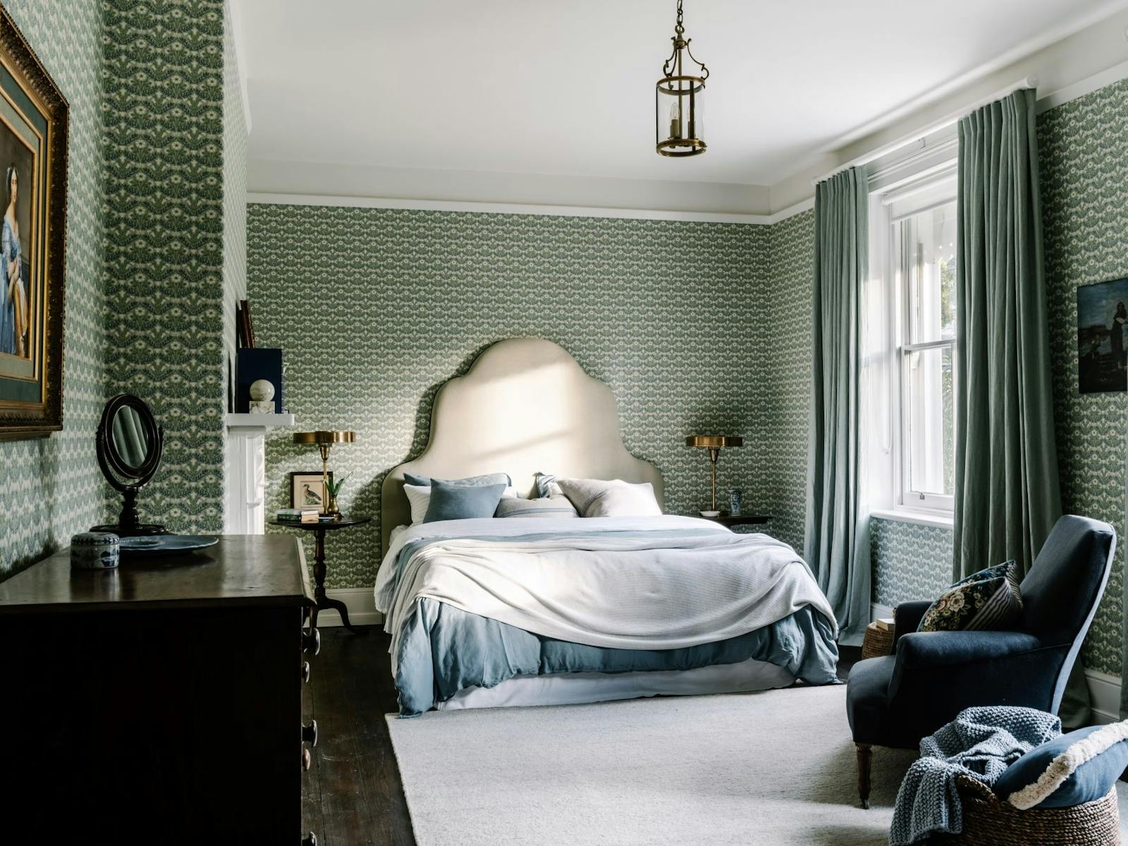 A large, light bedroom in a Georgian house with natural light, textural linen and decor.