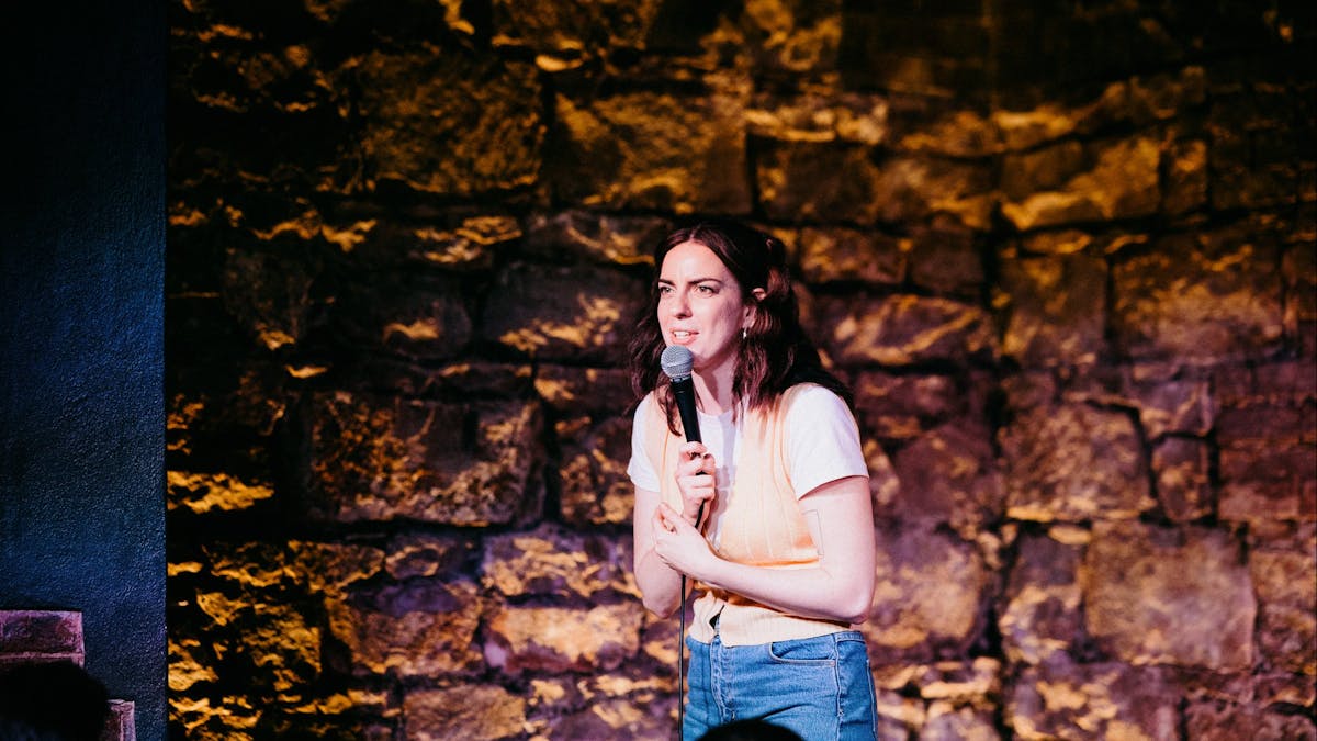 Emma Holland on stage at Good Chat Comedy Club