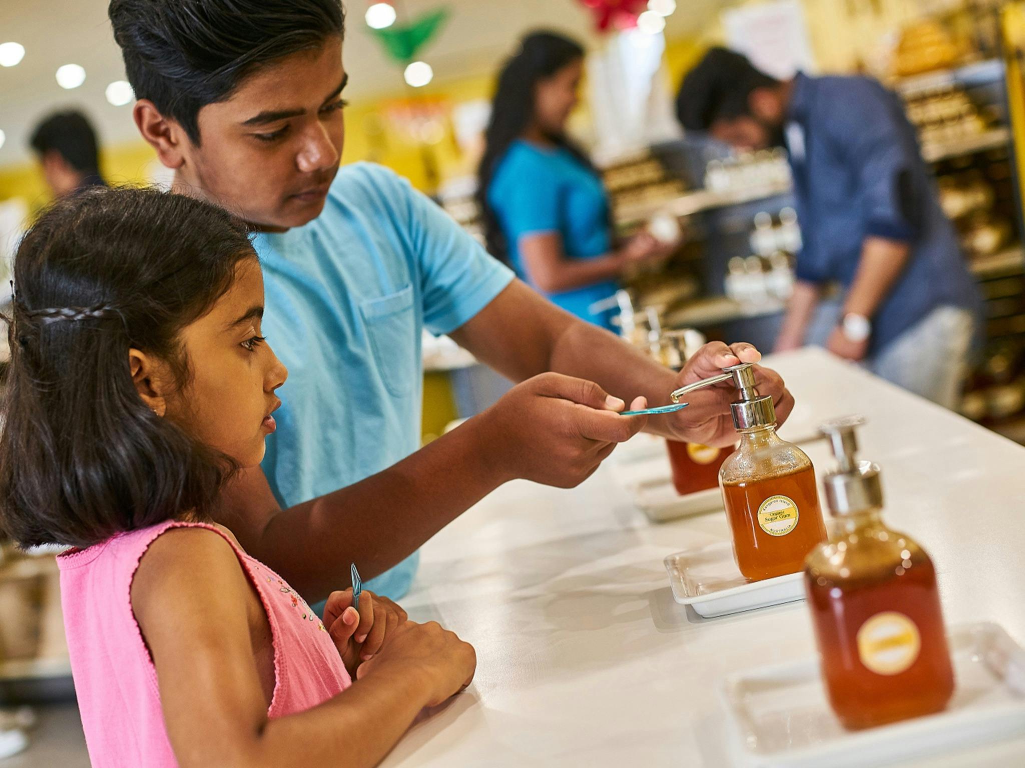 A family taste test different honey types