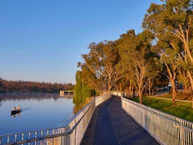 Boardwalk on right and Lake Inverell with Kayaker on left