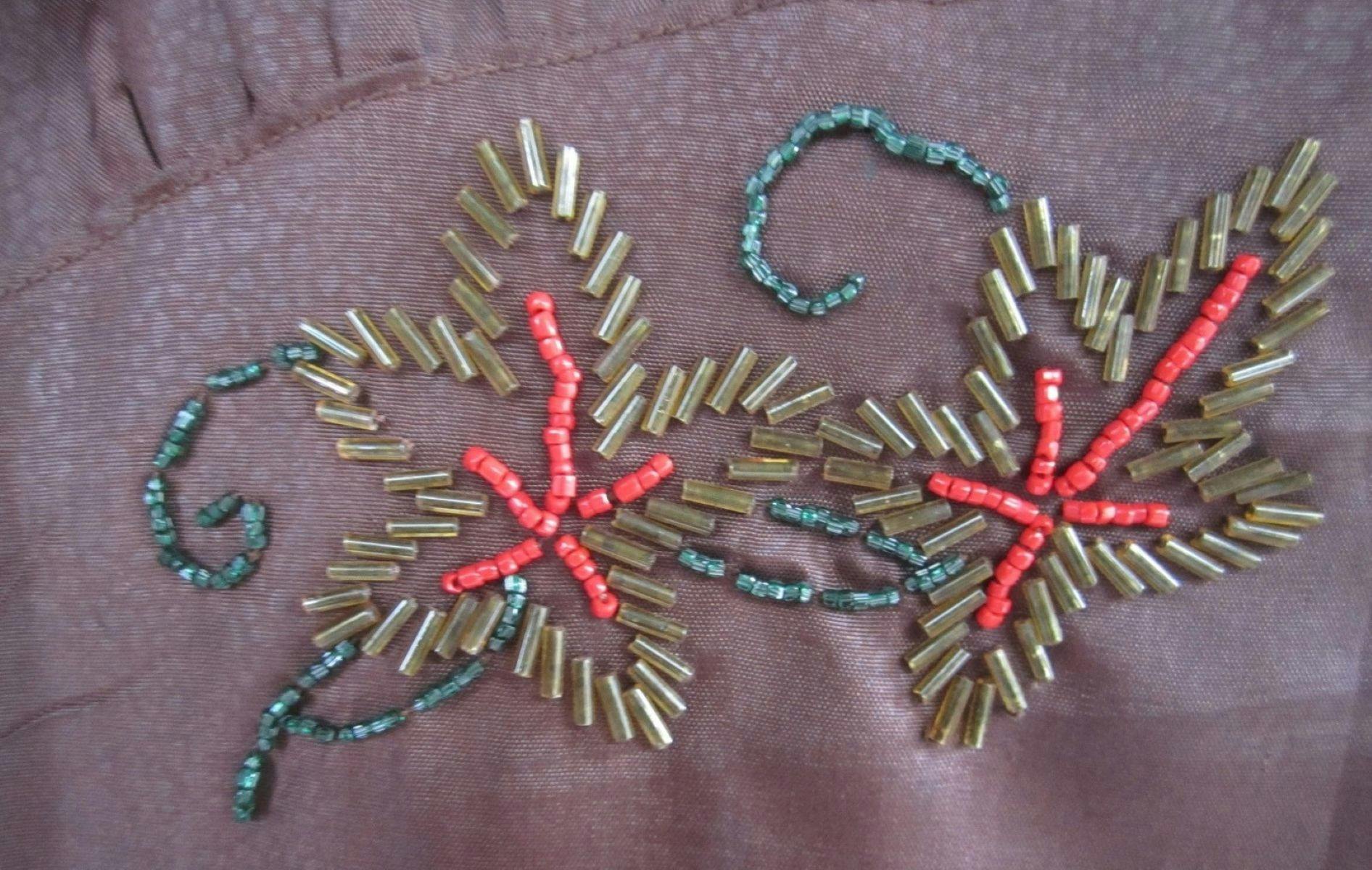 Showing the beading applied to a cocktail dress