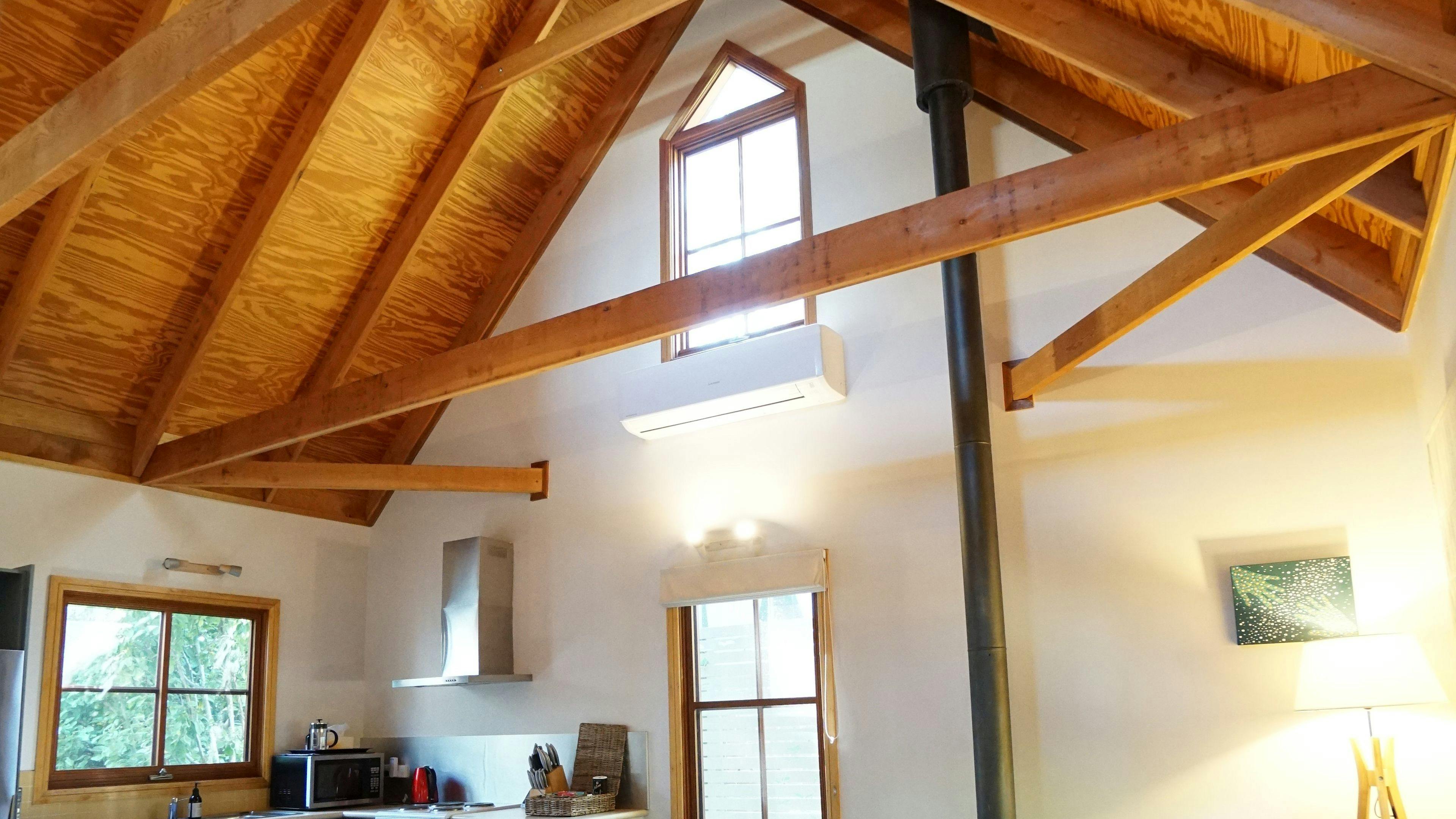 Traditional mountains cottage with enormous cathedral ceiling gives the small cottage a true sense of space as you relax by the fireplace.