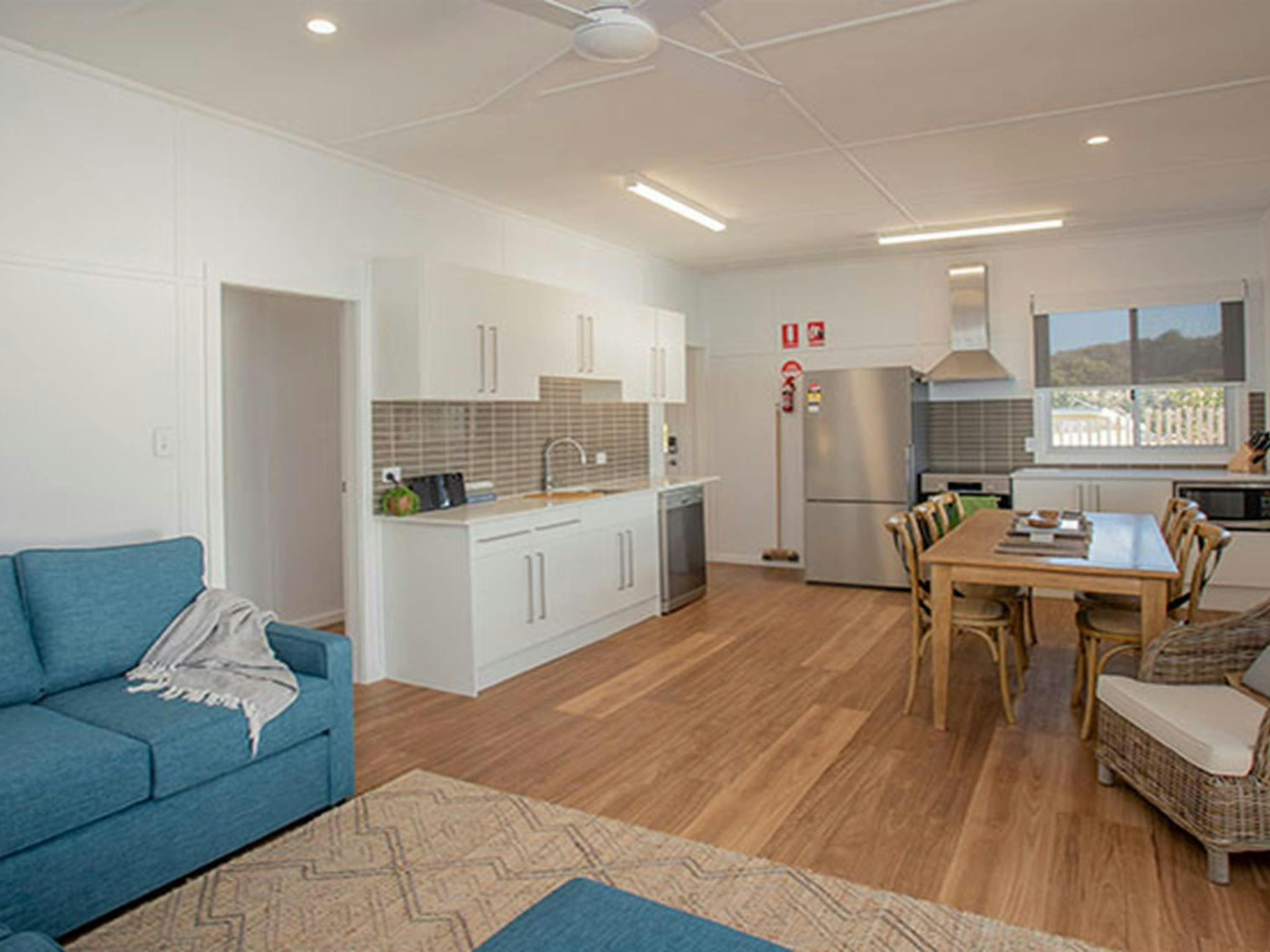 The lounge, dining room and kitchen in Davies Cottage, Myall Lakes National Park. Photo: John