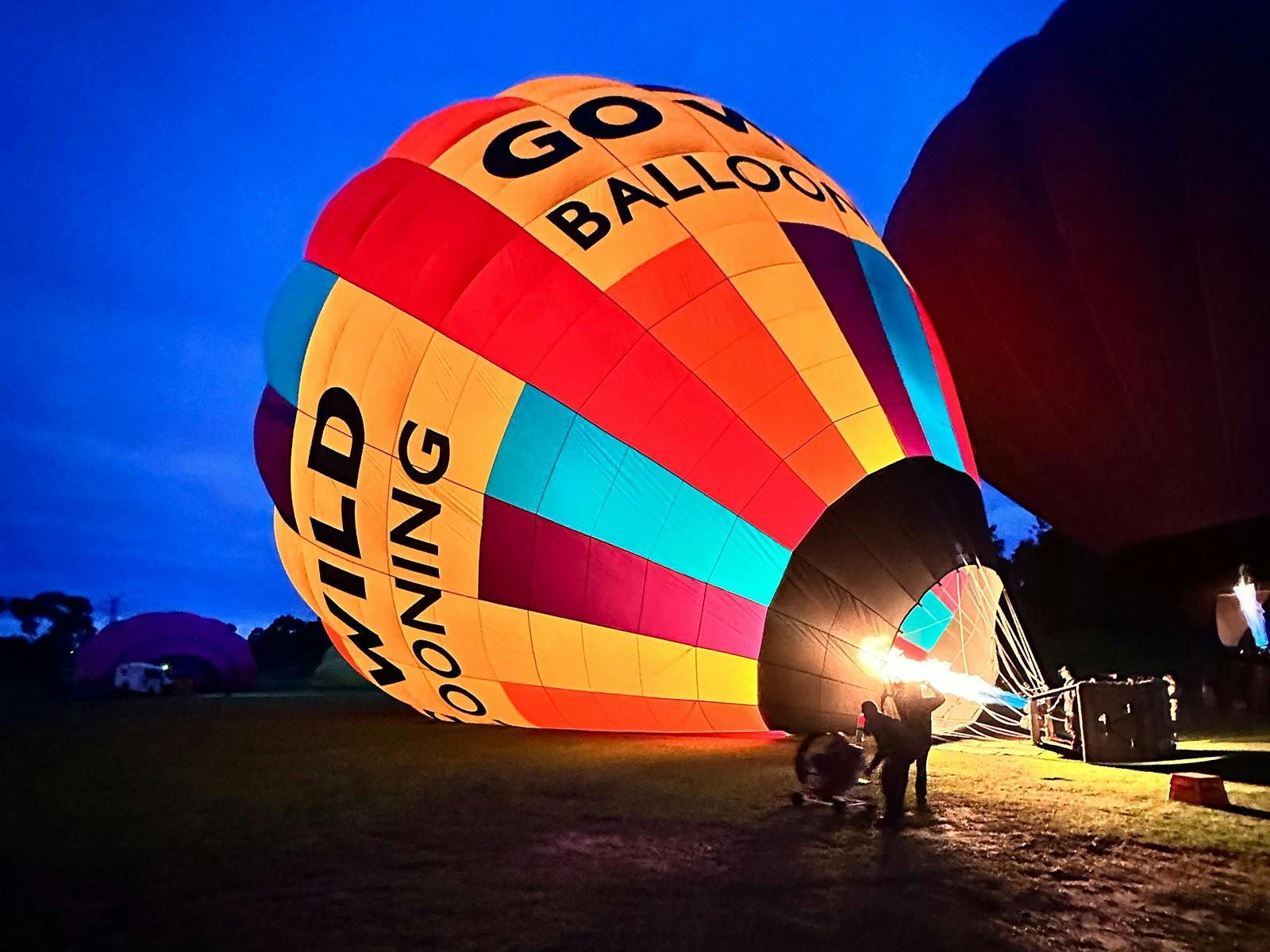 Burners inflating the balloon in Melbourne at dawn.