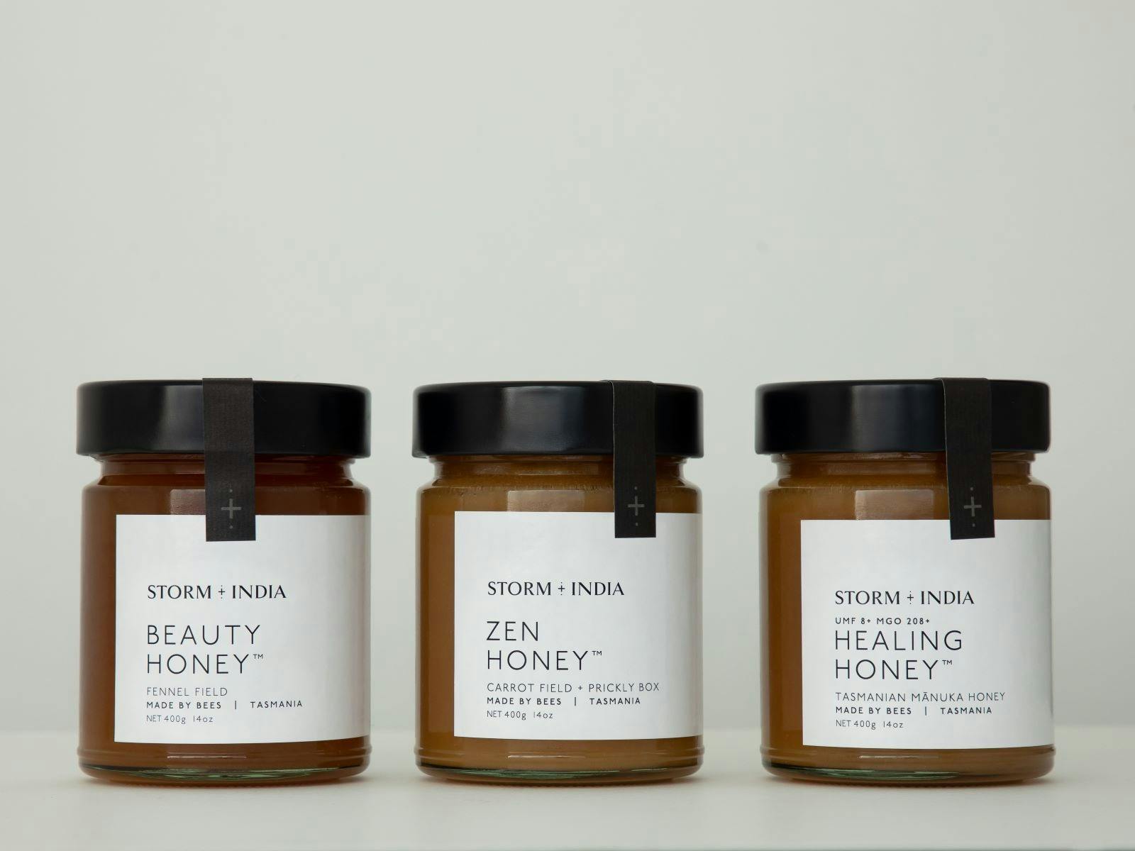 Picture of all three storm and india honey jars, Zen, Beauty and healing honey