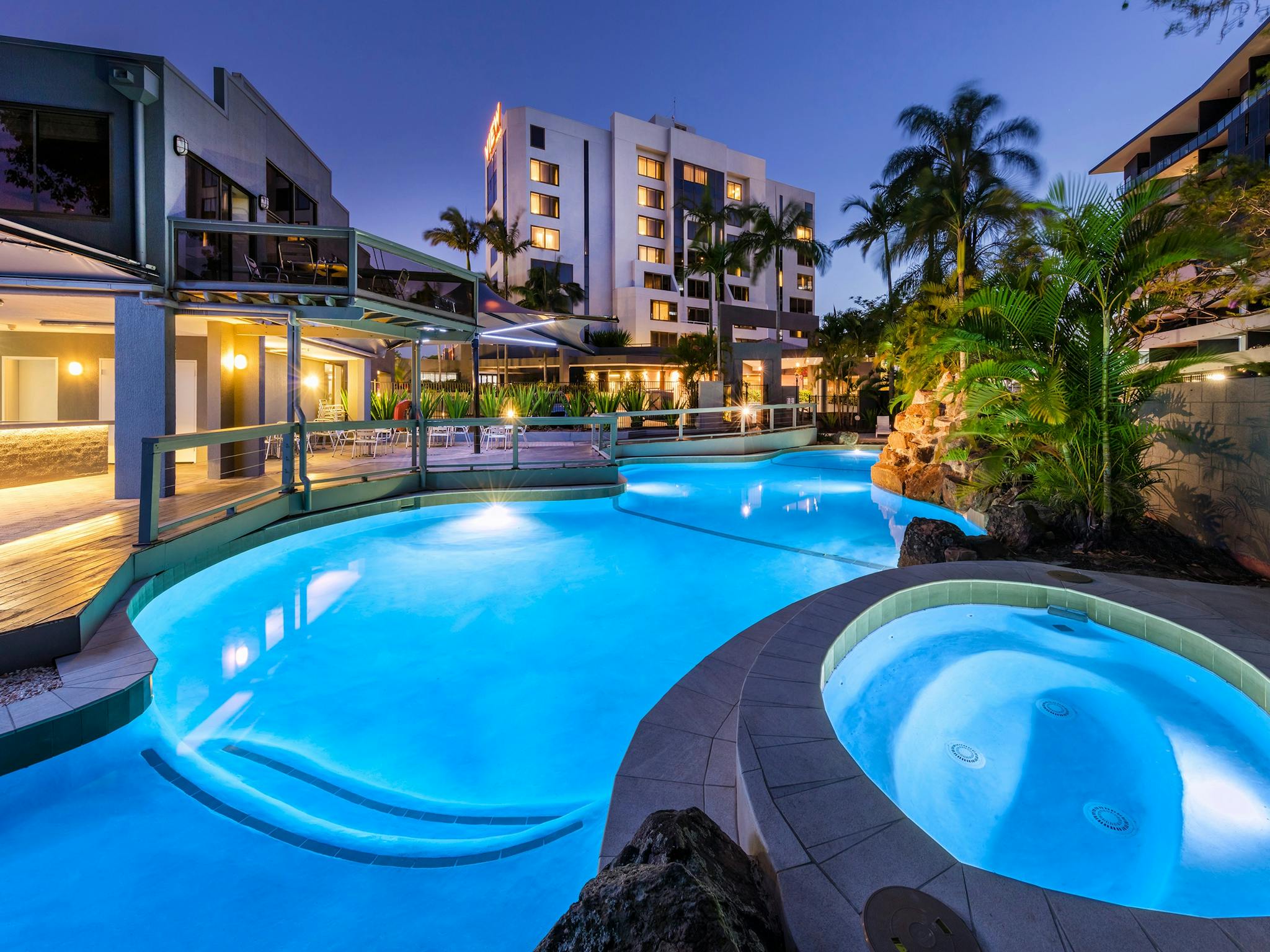 Hotel pool and spa at dusk Hotel pool and spa at dusk
