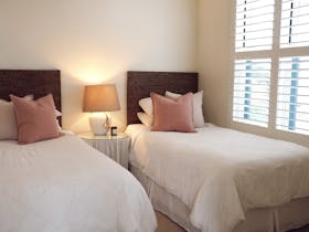 Bedroom with two king single beds.