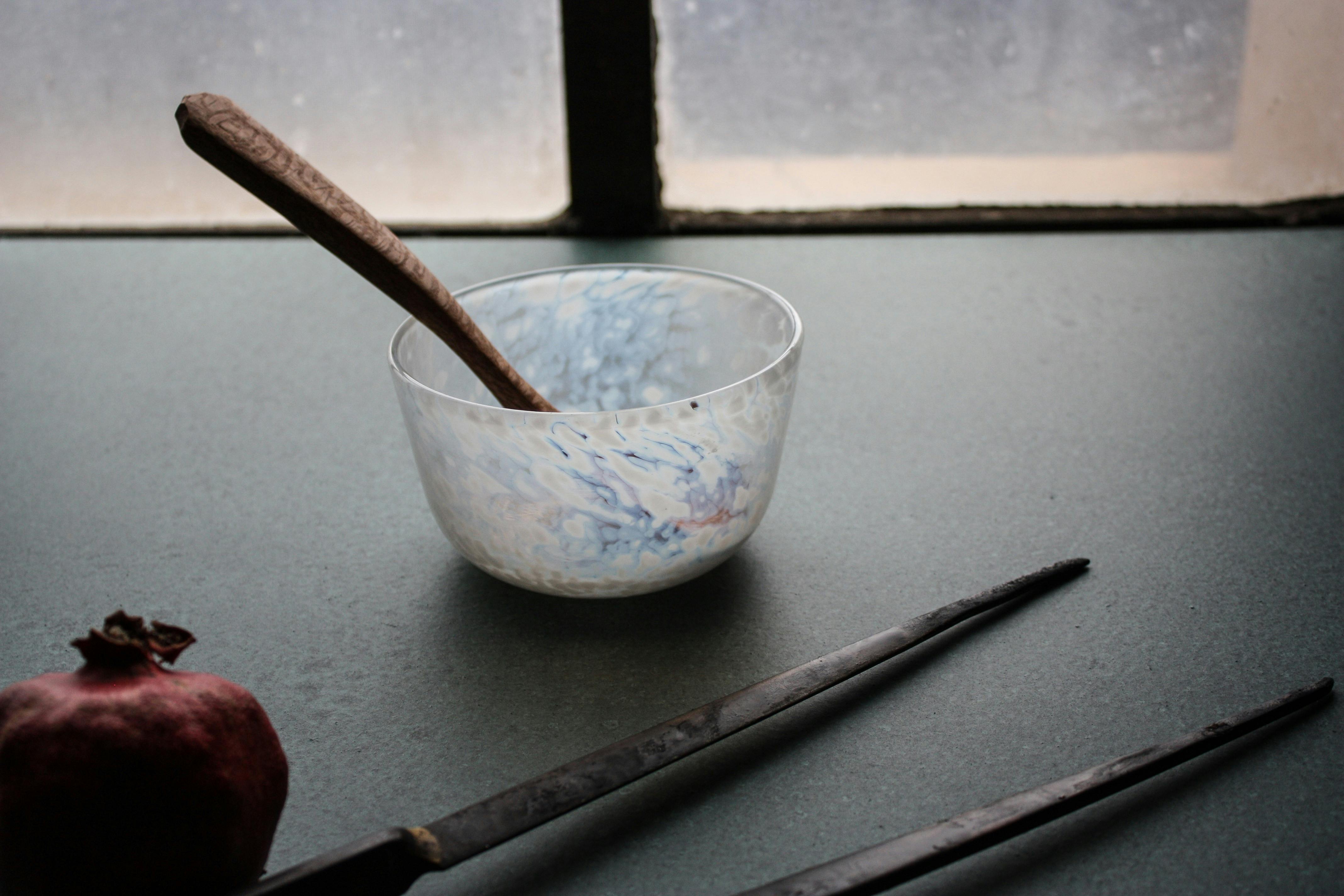 hand carved wooden spoon, and blown bowl