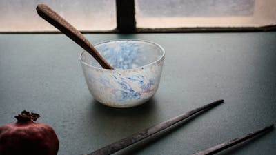 hand carved wooden spoon, and blown bowl