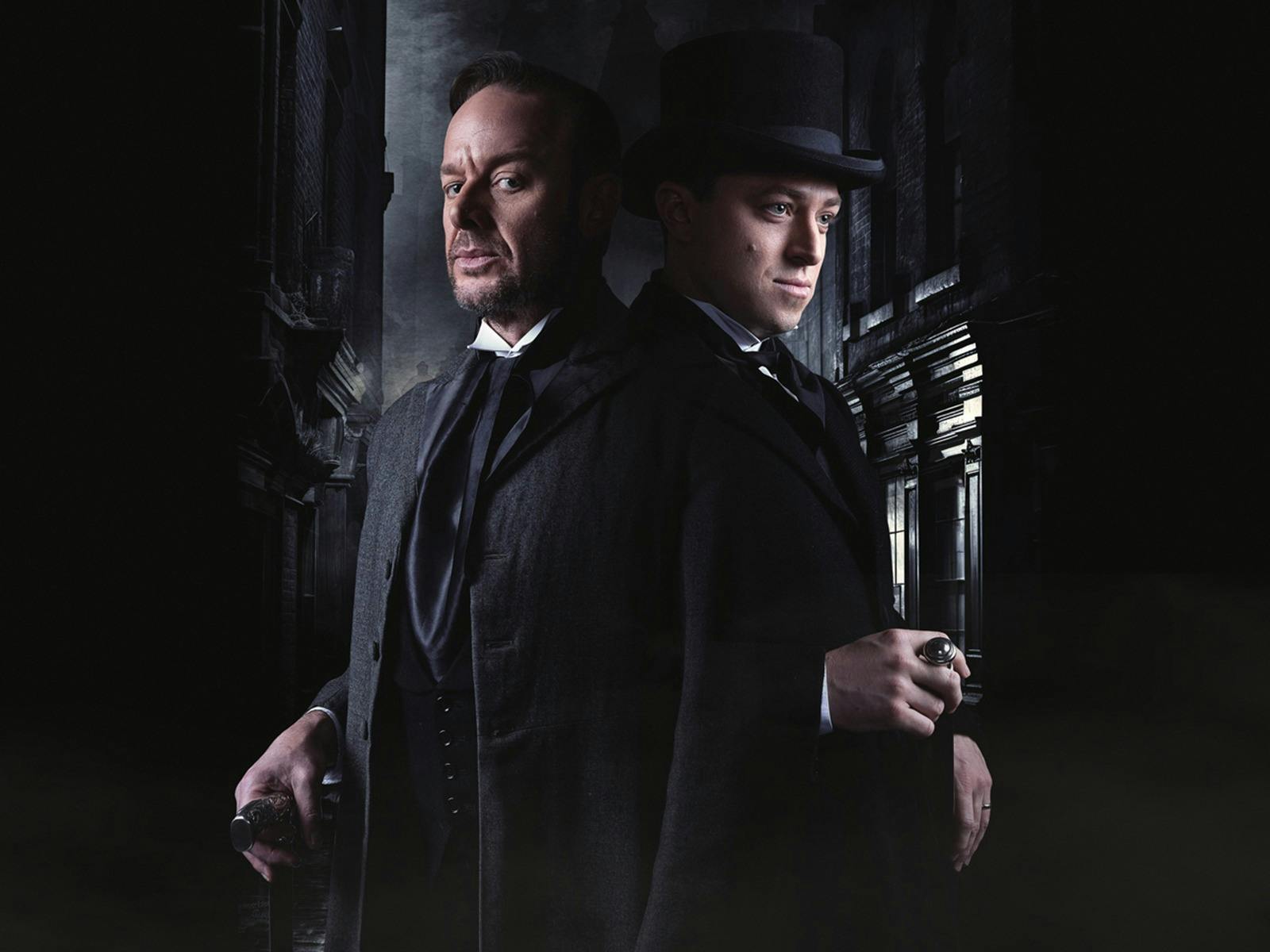 Two men in film noir contrast stand back to back