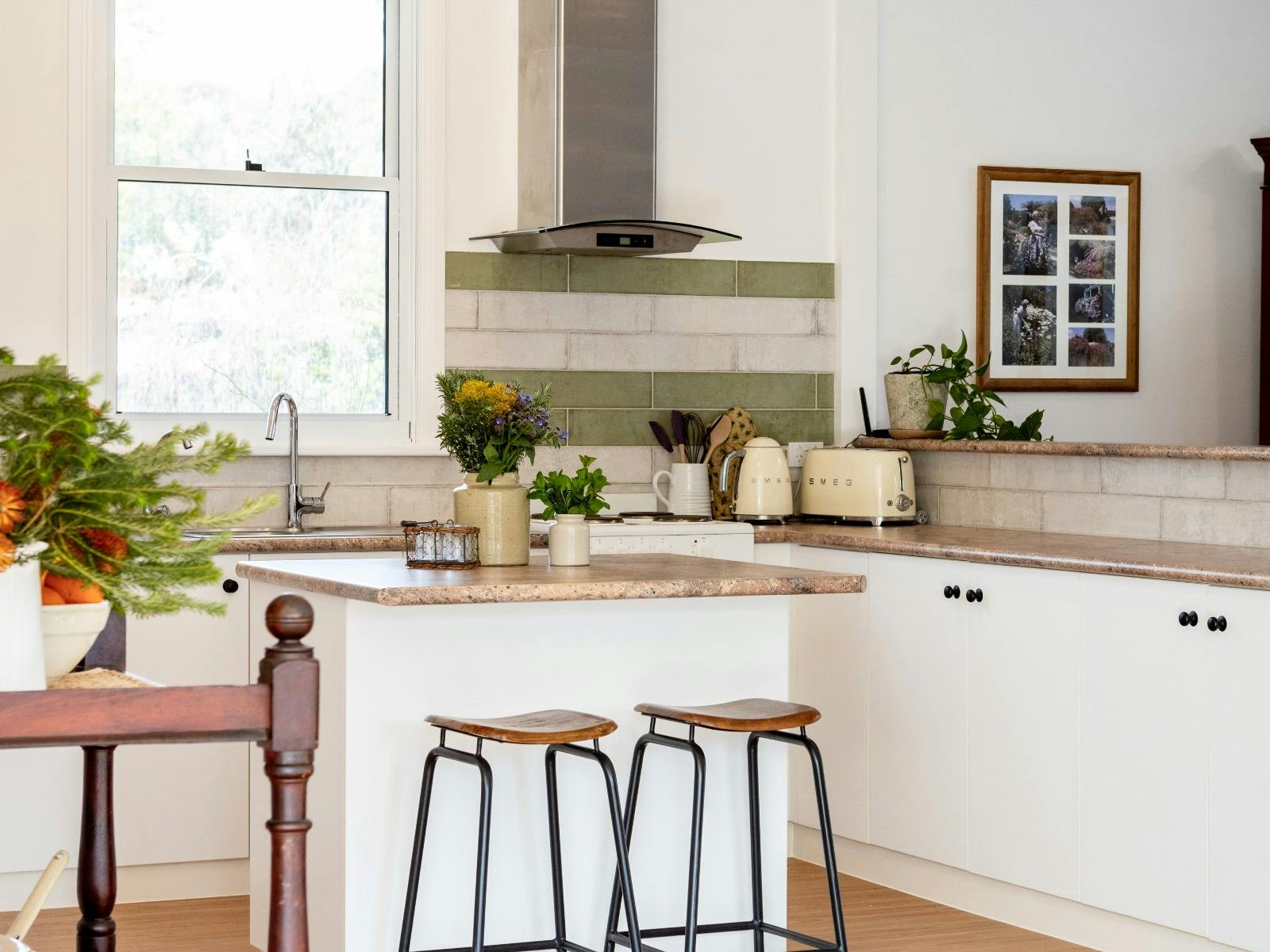 A fully-equipped kitchen, including a full-sized fridge, oven, stovetop, and microwave.