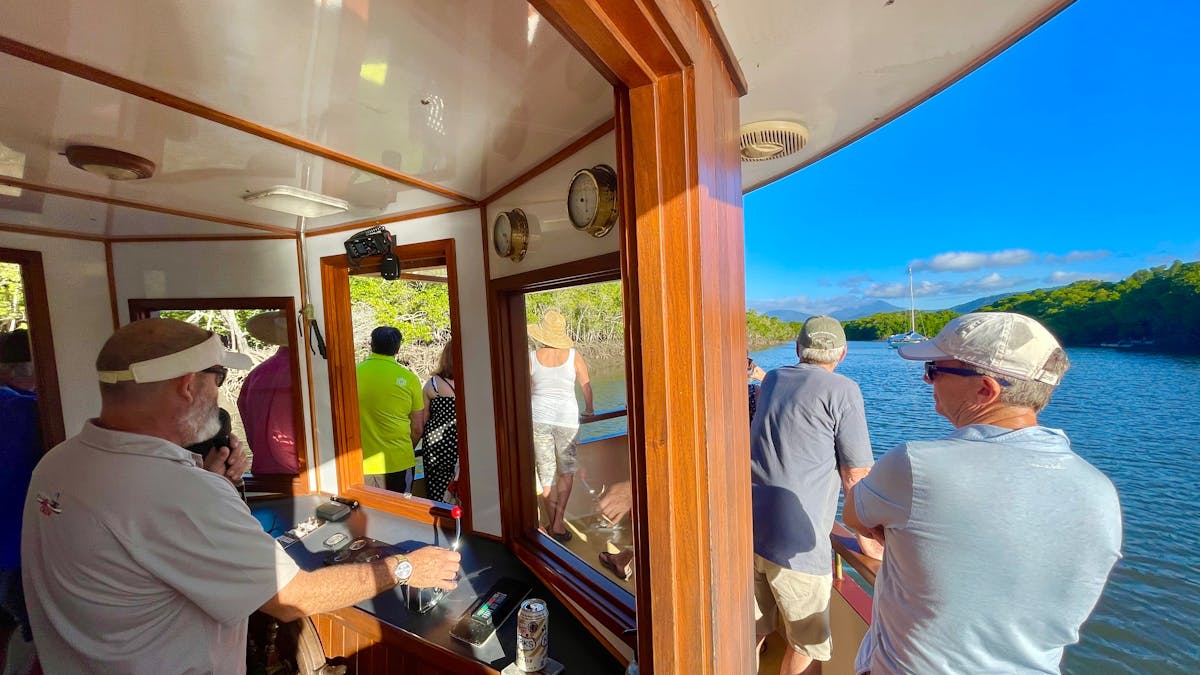 Guests enjoying the skippers informative chat onboard Lady Douglas River Cruises, Port Douglas, QLD