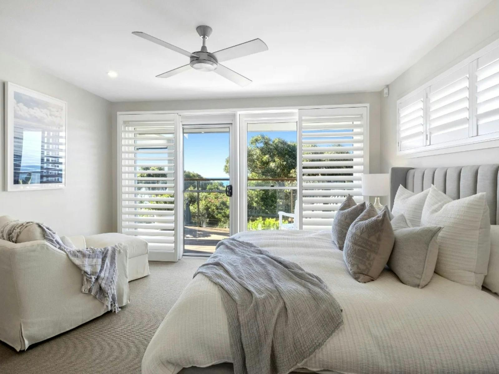 Master bedroom with ensuite, walk-in wardrobe, and panoramic ocean views