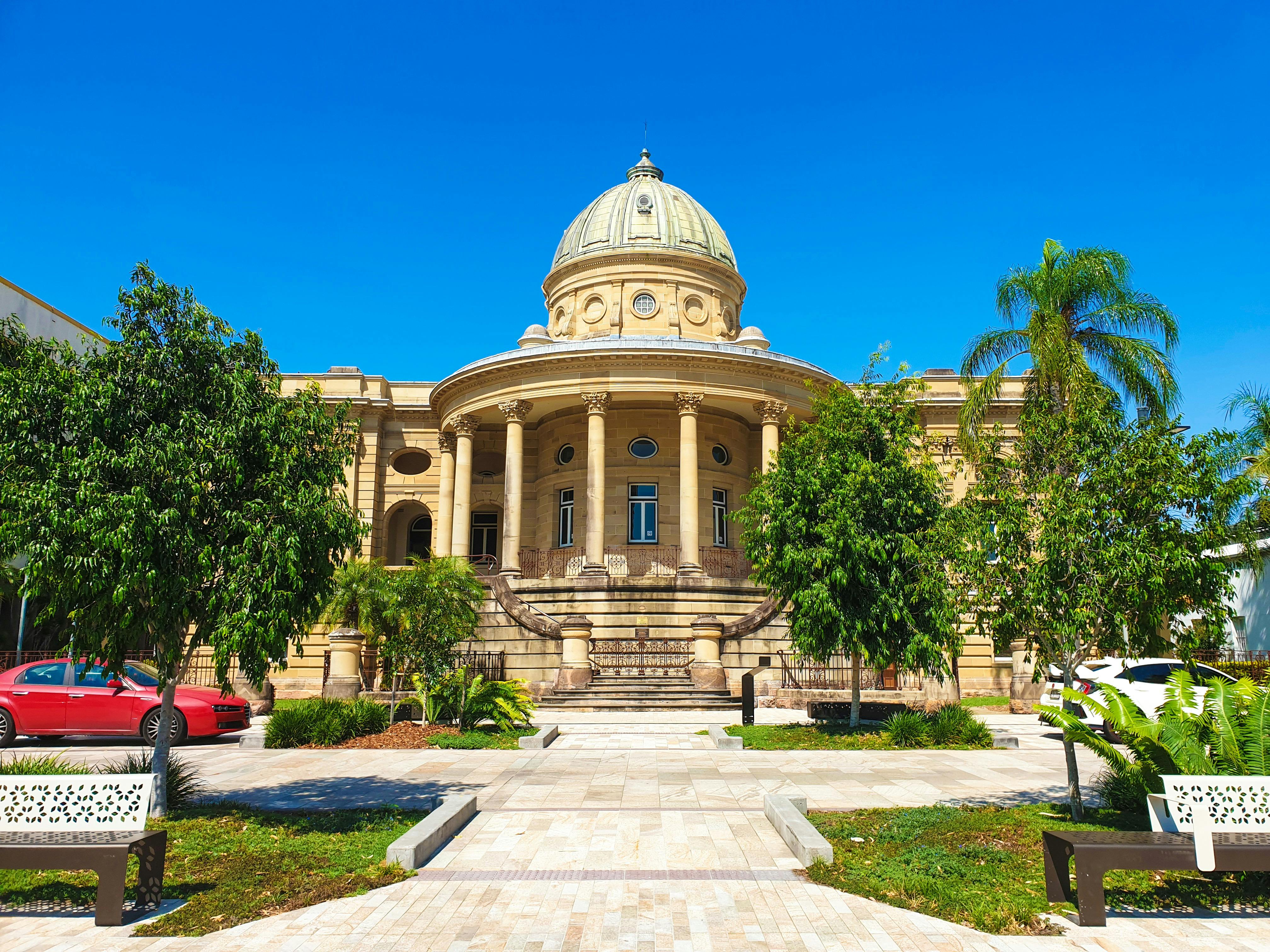 Photo of Customs House Building on a blue sky day.
