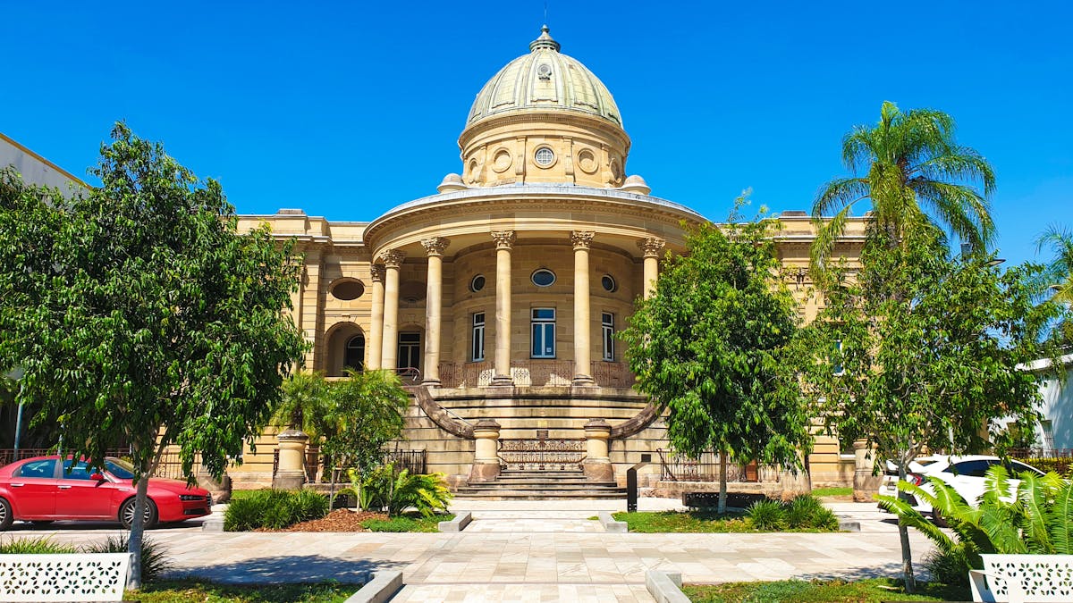 Photo of Customs House Building on a blue sky day.