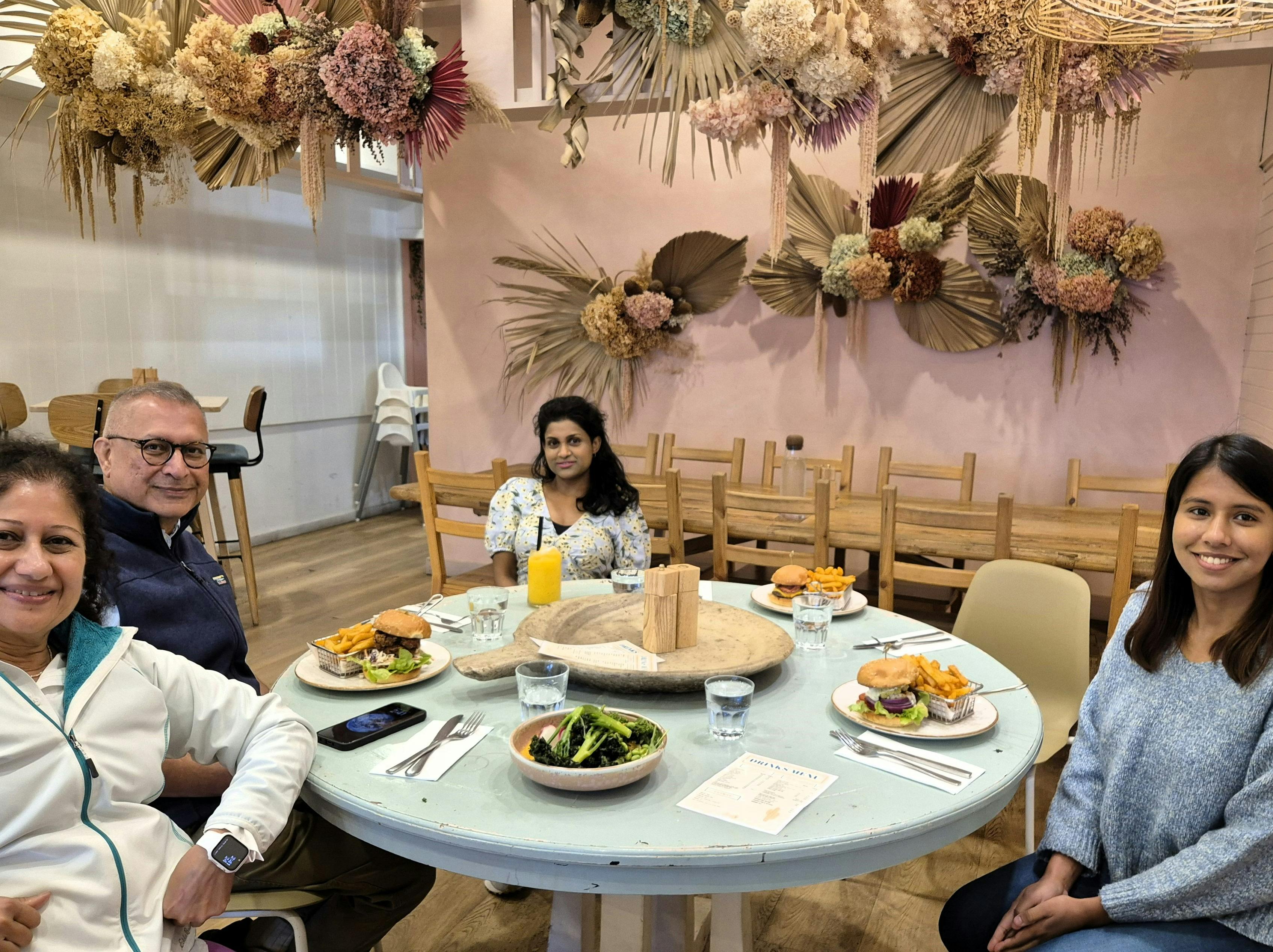Family seated with lunch meals in a local cafe