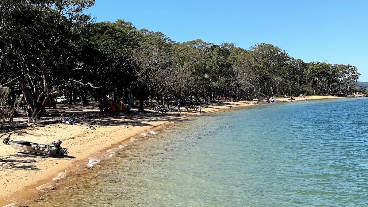 People fishing and enjoying the beach on Coochiemudlo Island, Redlands Coast