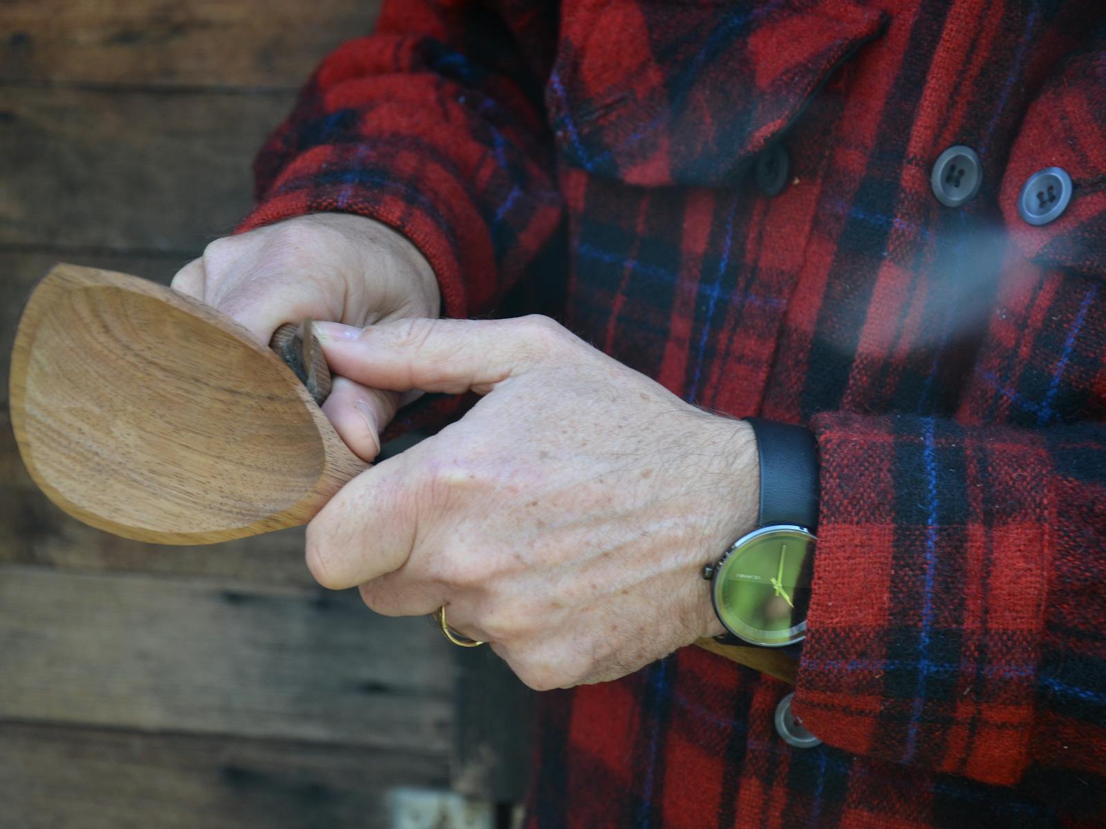 David of Phoenix Creations, hand carving a spoon.