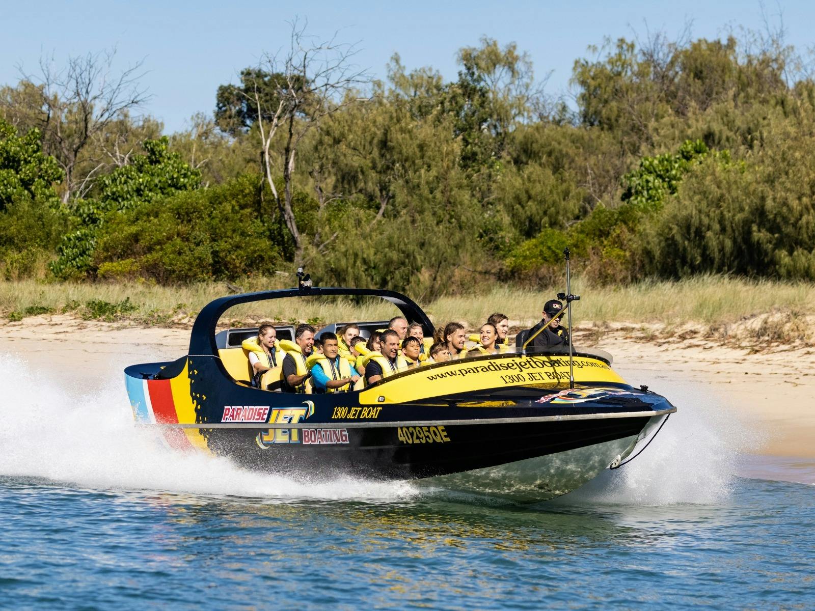Paradise Jet Boat riding past beach