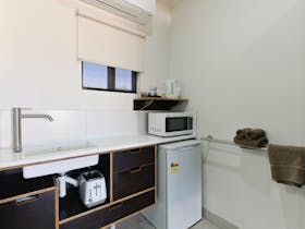 Room facilities include fridge, tea and coffee making facilities, sink and microwave