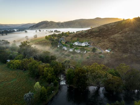 Cottages on the hill with the sun rising