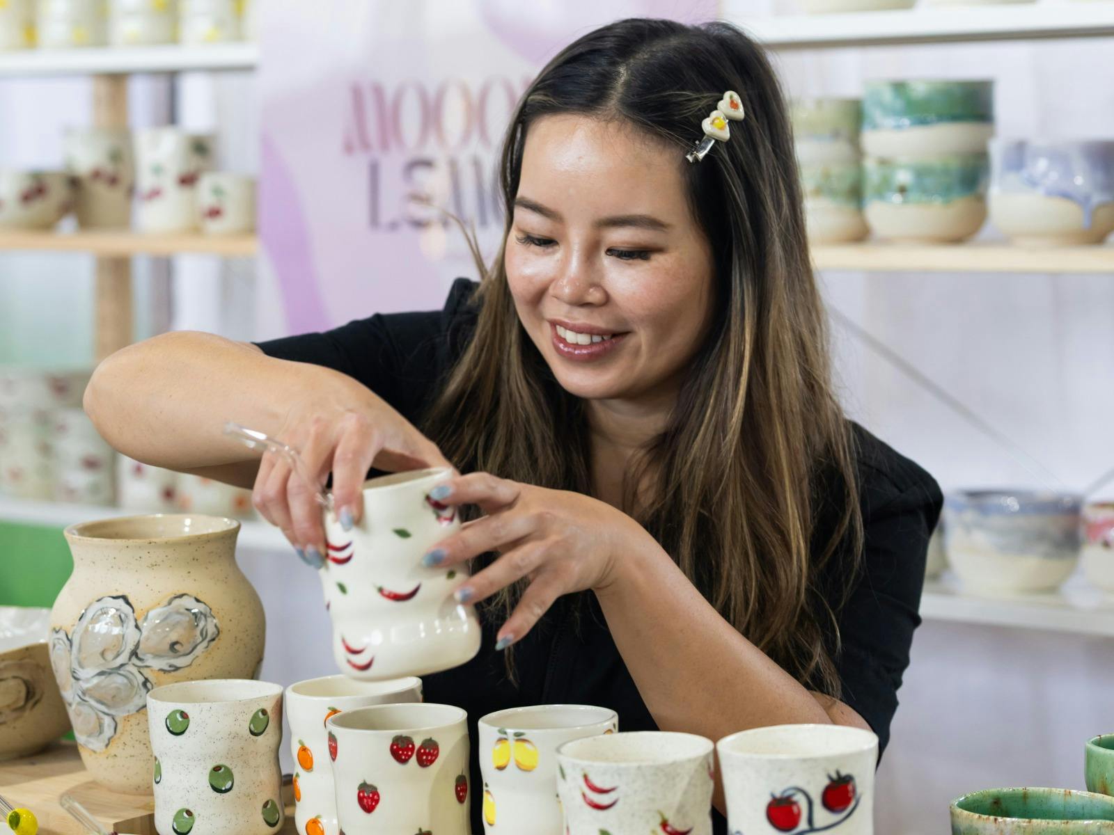 Mooody Lemon holding a ceramic cup