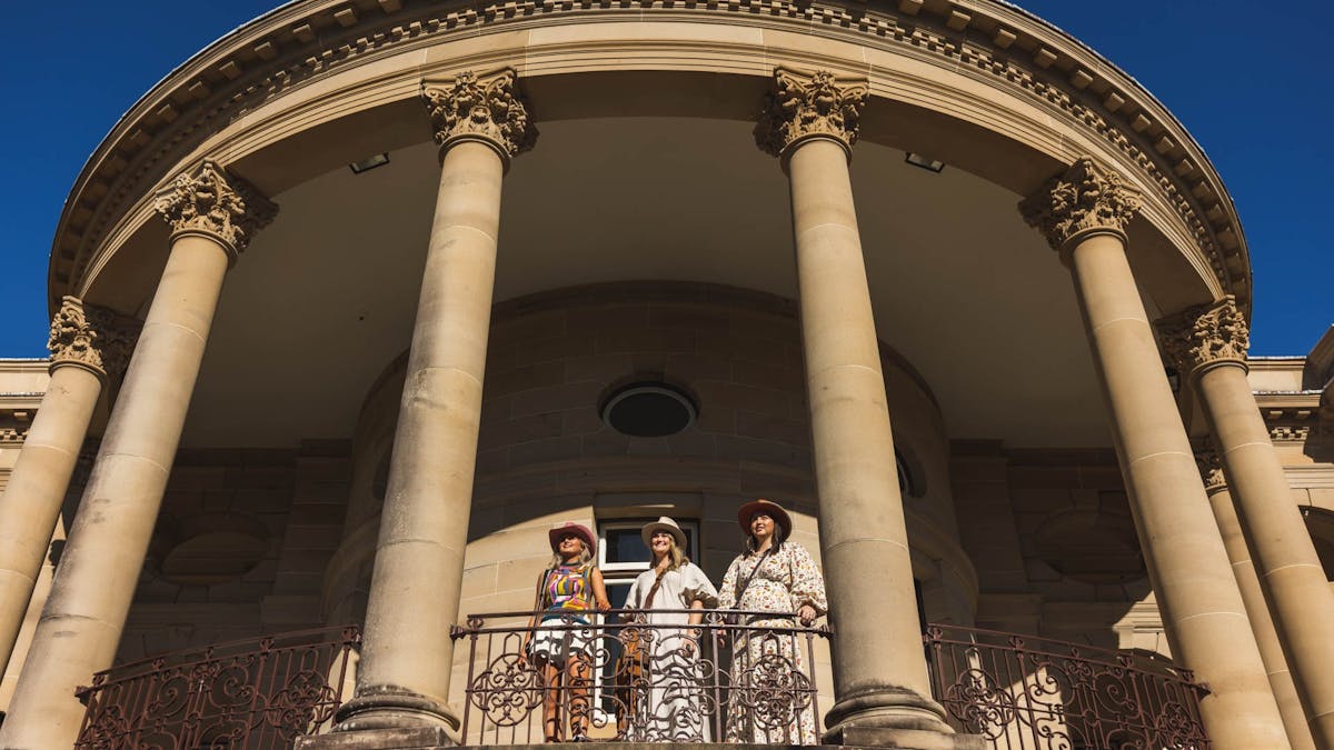 Three young girls overlook the Rockhampton River Precinct from Customs House