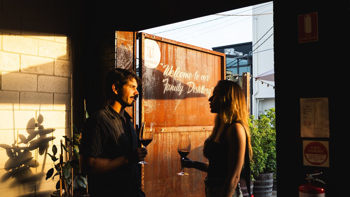 a couple enjoying a glass of red