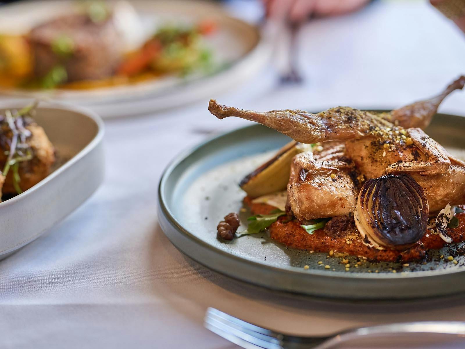 Butterflied quail finely plated at Iris