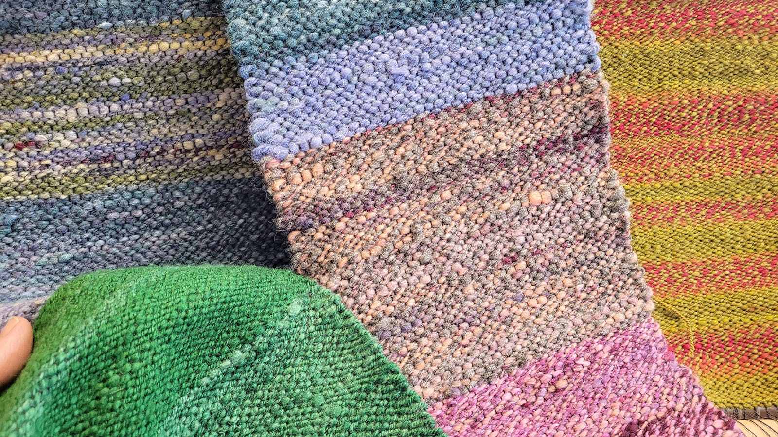 Soft scarves of natural and colourful merino handspun yarn are a warm delight to wear.