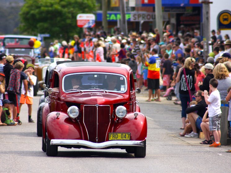 Old cars in a street parade